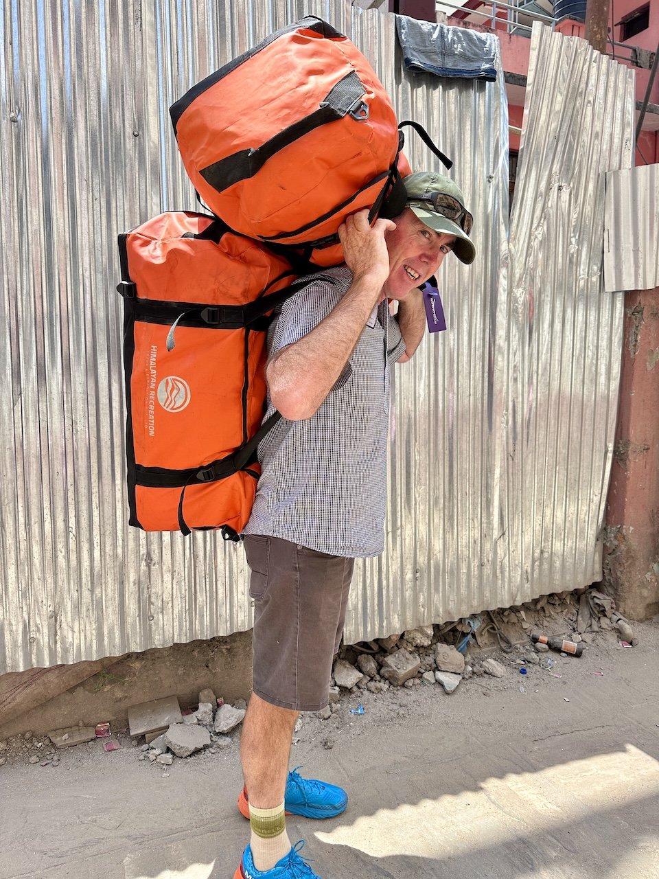 Andrew carrying two Himalayan Recreation duffel bags