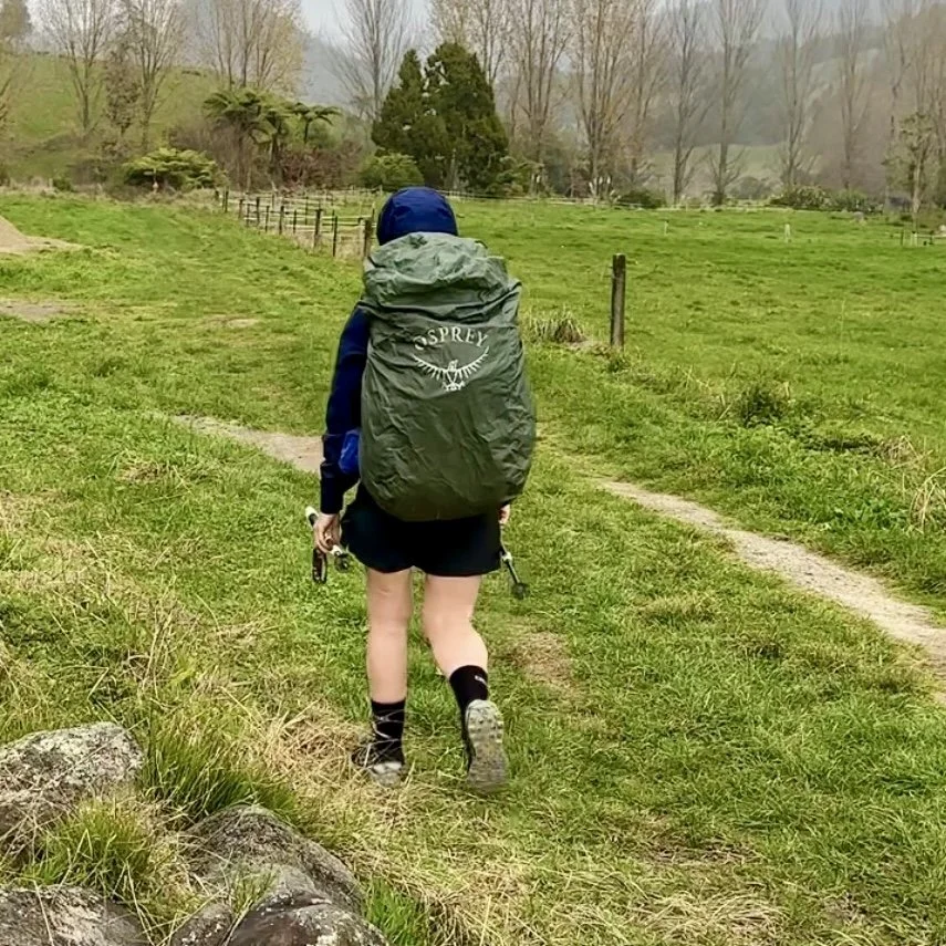 Sharon carrying a full backpack on the Waitawheta Track, Kaimai Forest Park