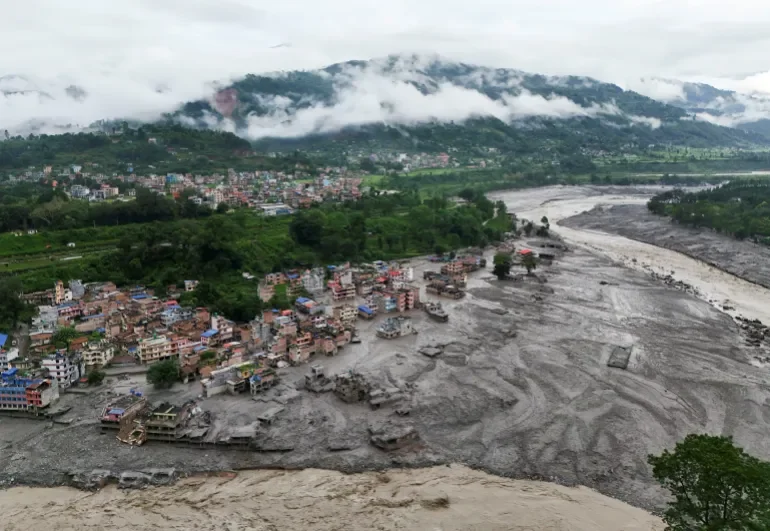 Aerial photograph of Devighat village in Nuwakot district, Nepal, after the August 26, 2026 flash flood.