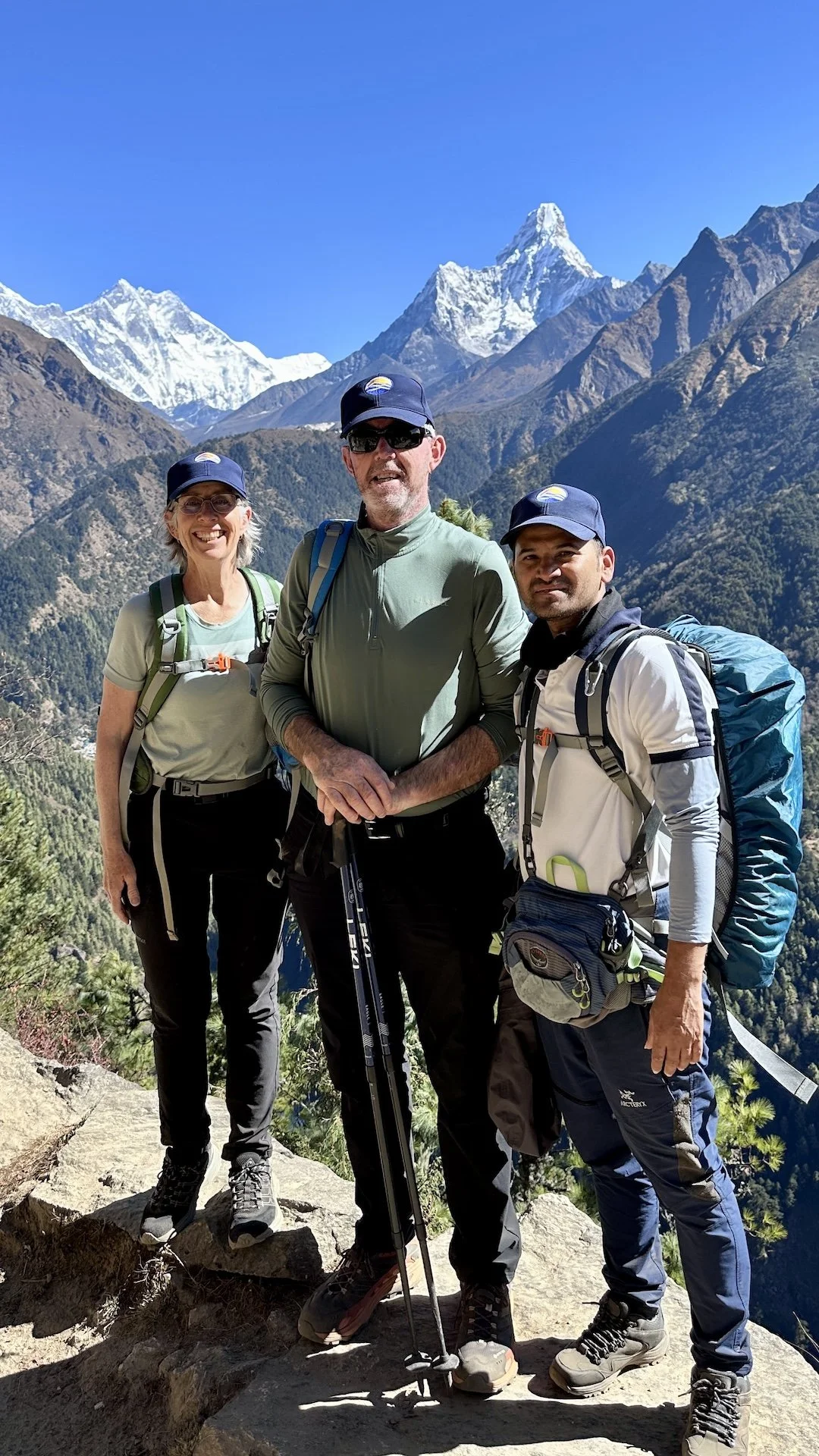 Everest Base Camp trekkers and guide with Ama Dablam as back drop