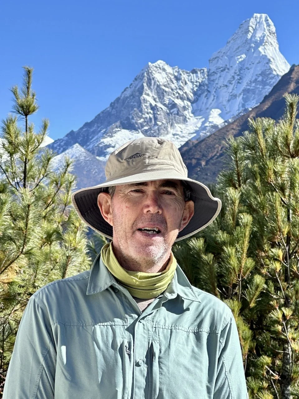 Everest Base Camp trekker in front of Ama Dablam