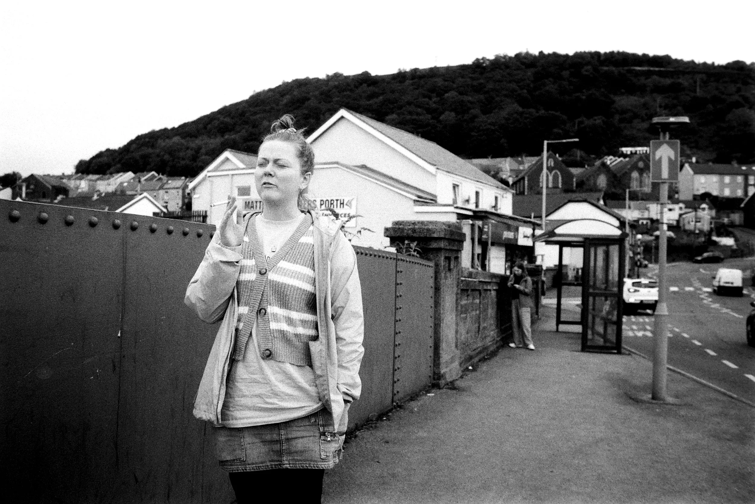 Woman Smokes on a bridge.jpg