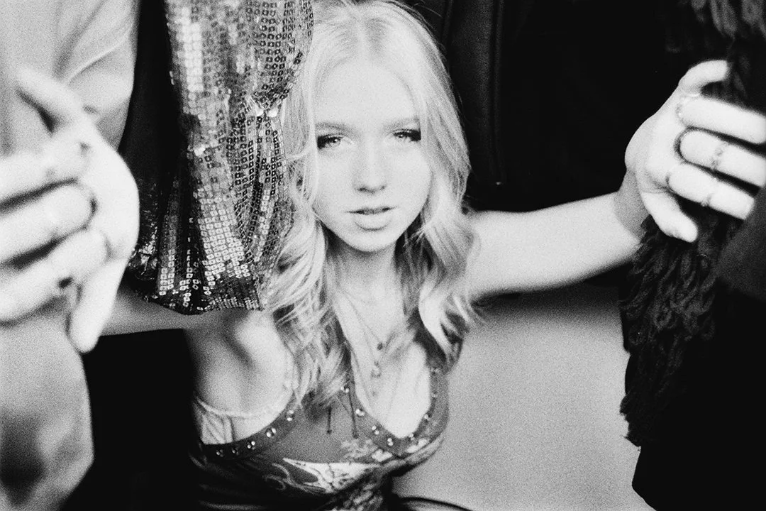 Girl in clothes rail 4.jpg