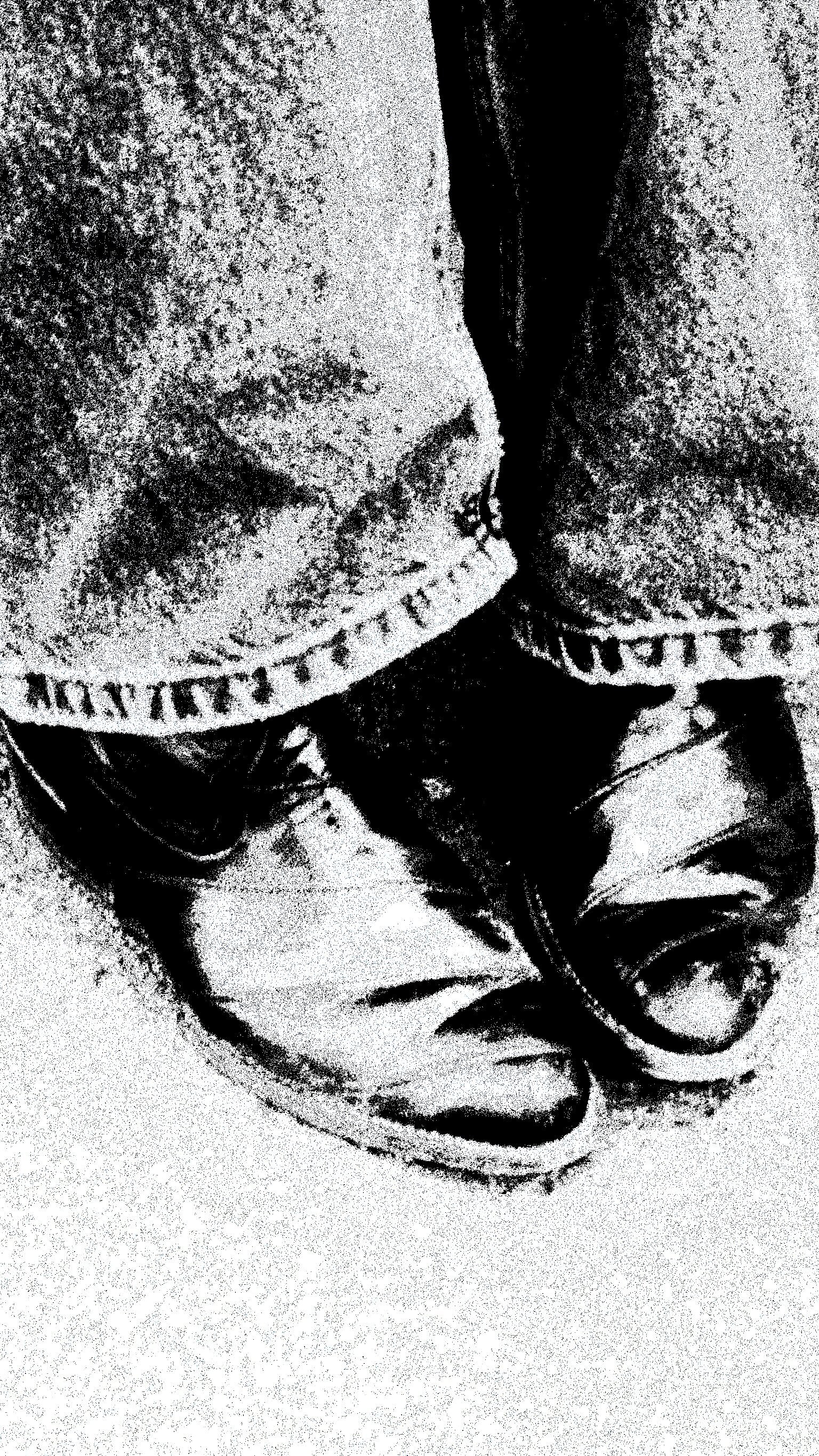A pair of booted feet shot up close. Their noses are together.