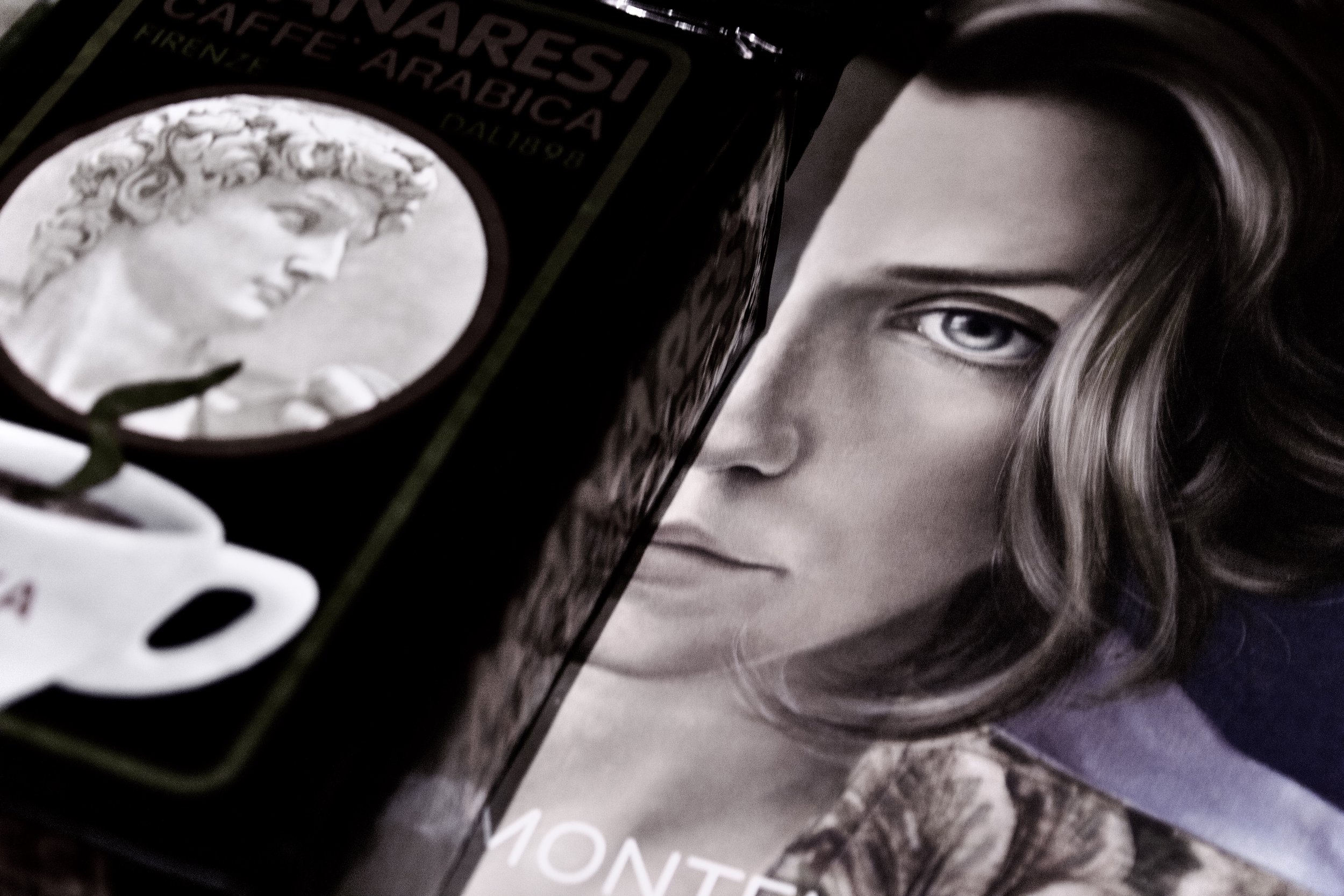 Close-up of a hair dye box with an image of a woman’s face in black and white, showing her with long wavy hair and intense eyes.