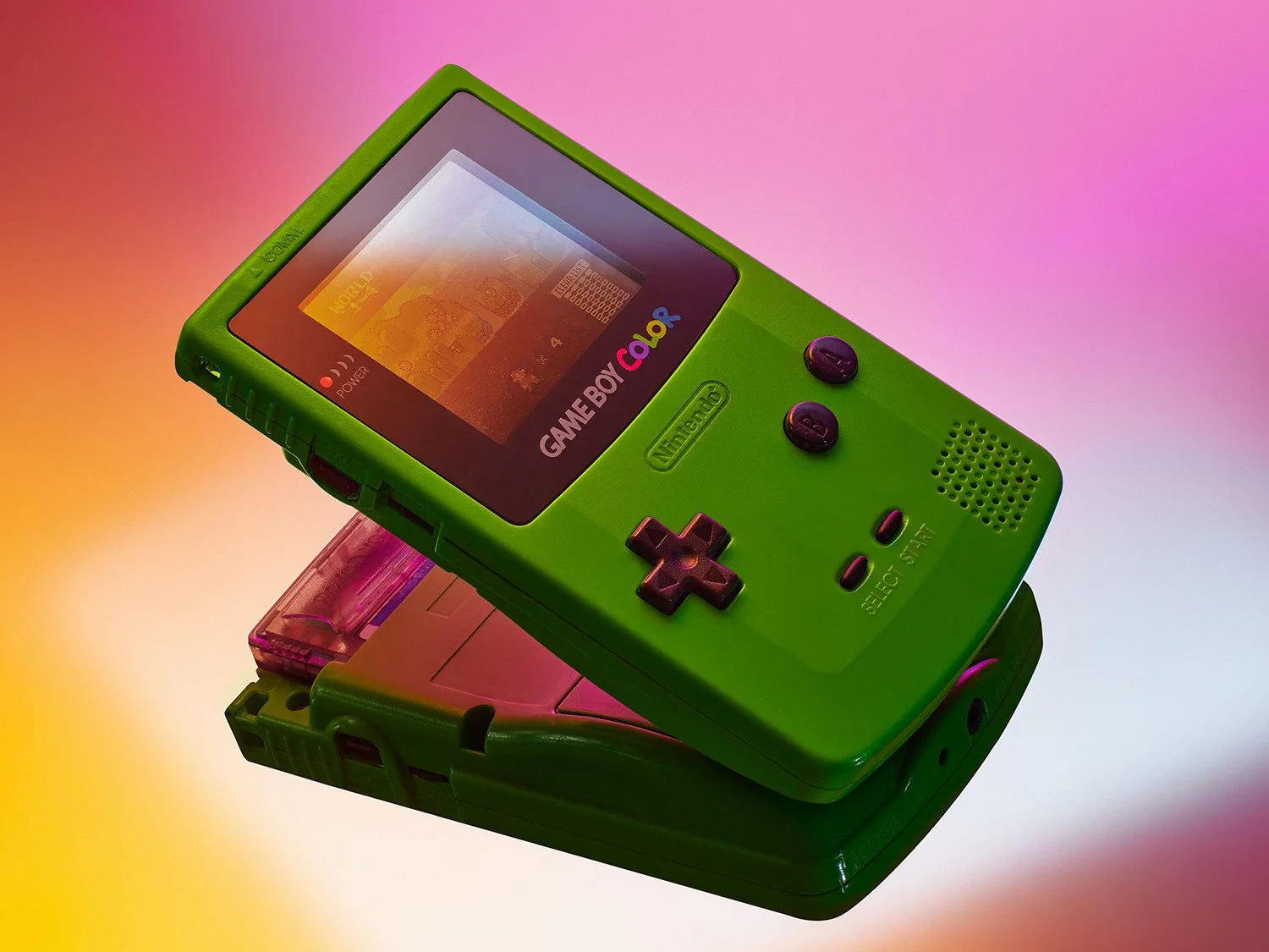 Lime green Nintendo Game Boy Color handheld console displaying a retro game on a vibrant gradient background.