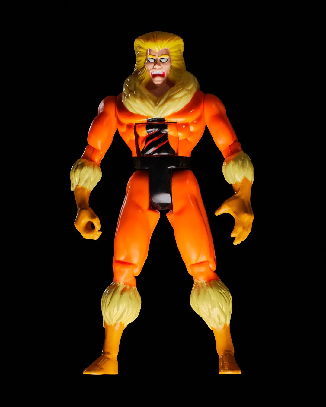 Sabretooth Marvel X-Men vintage action figure with orange suit and blonde fur collar against black background