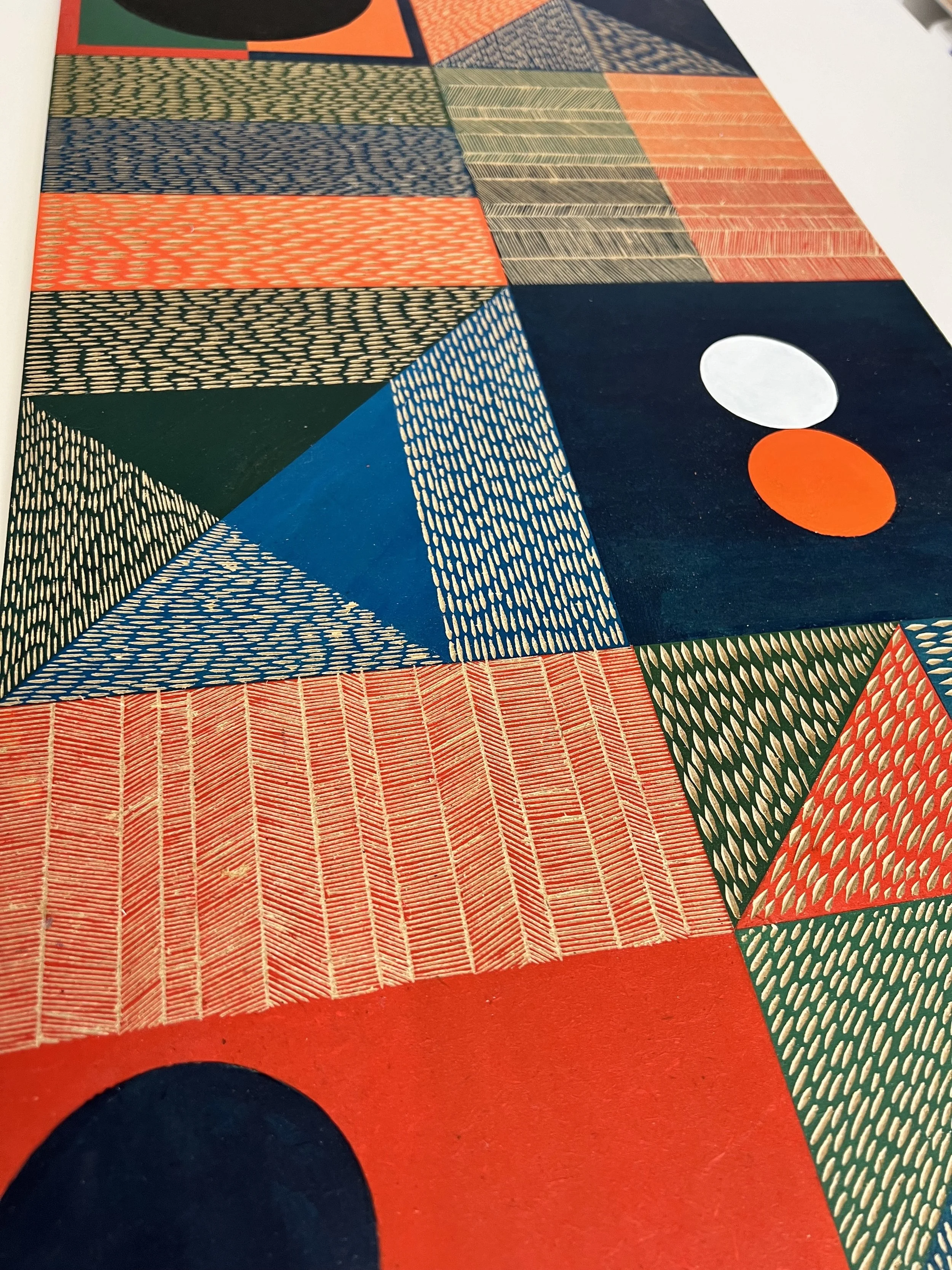 Colorful geometric abstract artwork with patterns, including triangles, rectangles, and circles in various shades of blue, green, orange, and other colors.