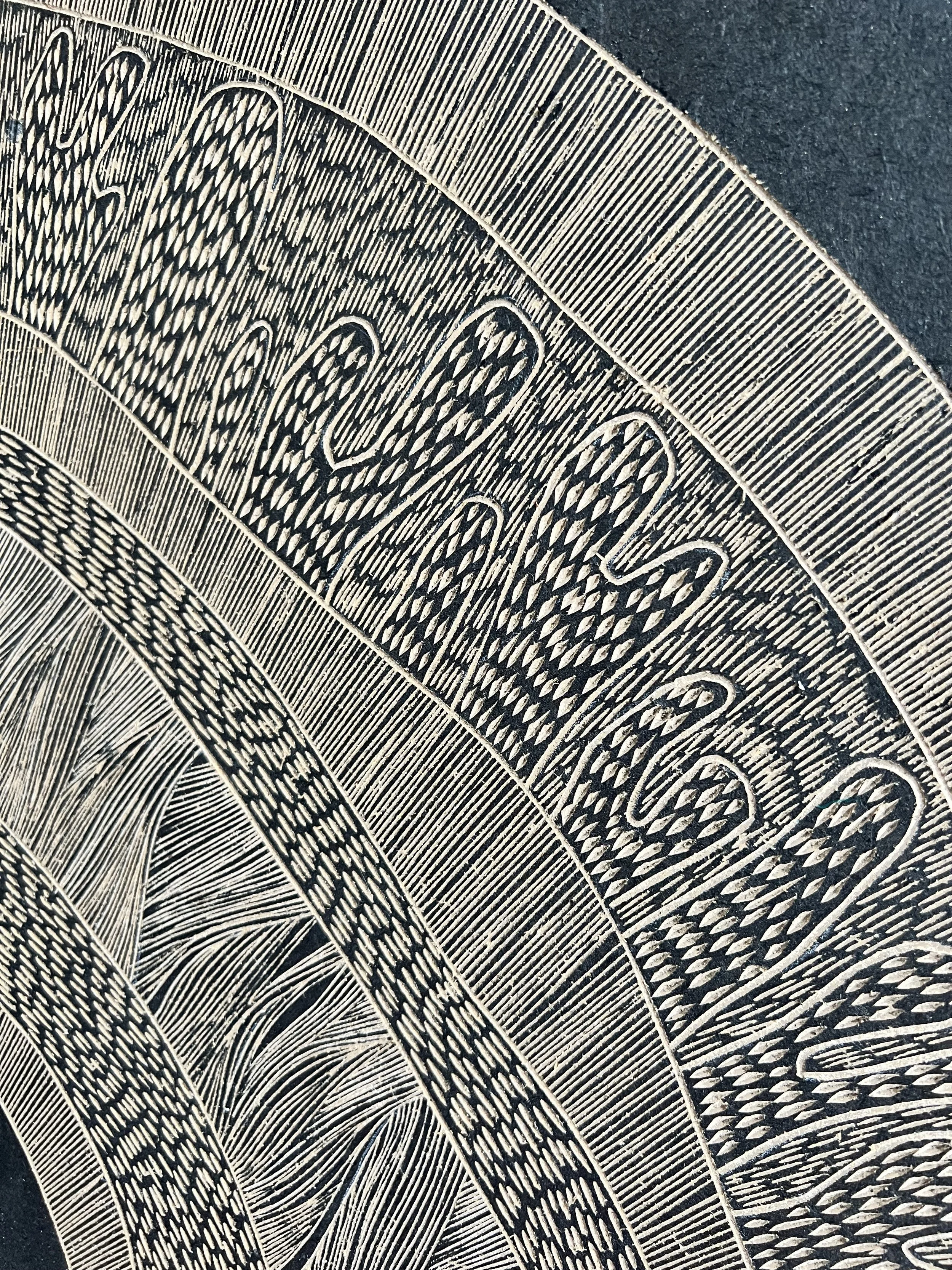 Close-up of intricate black and white abstract pattern, featuring organic shapes and detailed line work, resembling waves or leaves.