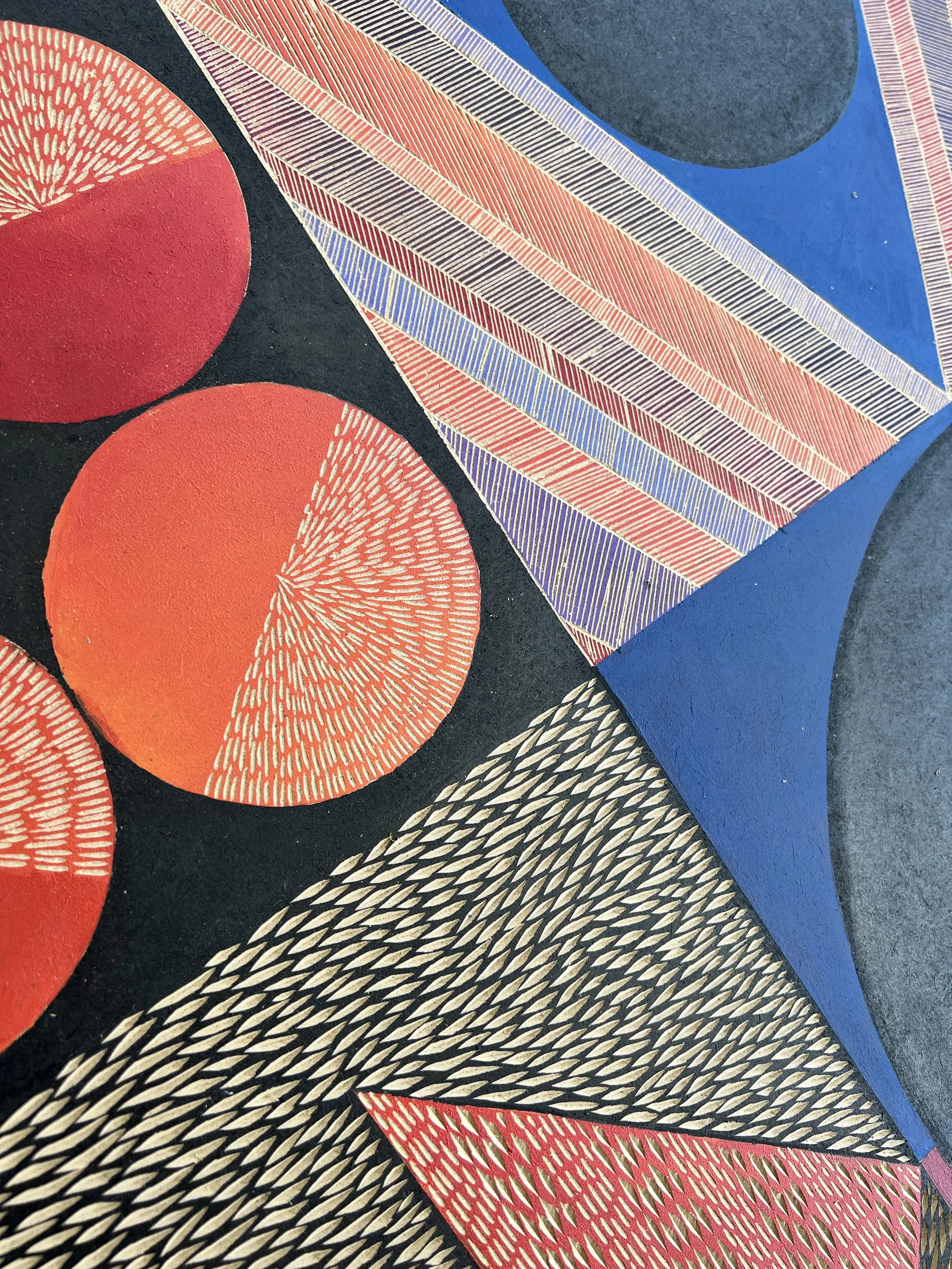 Abstract geometric artwork featuring red circles with detailed textures, blue triangular shapes, and a variety of intricate patterns on a dark background.