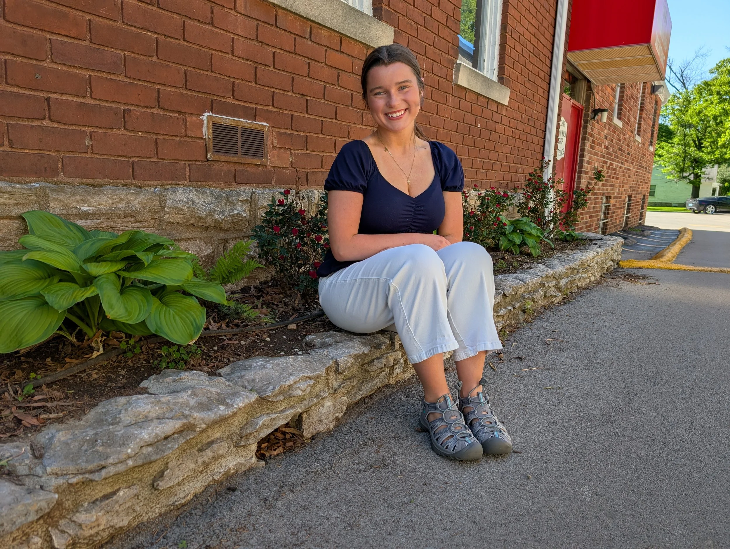 woman outside John's Run/Walk Shop wearing KEEN sandals