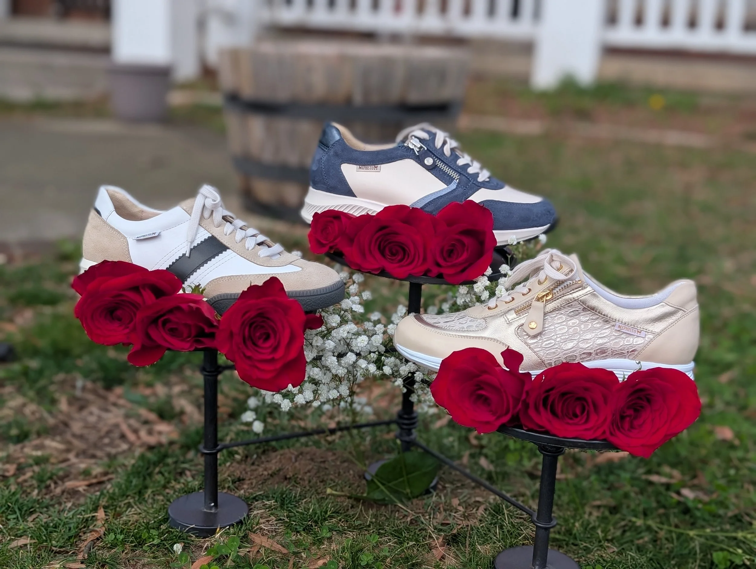 shoes sitting outside with roses