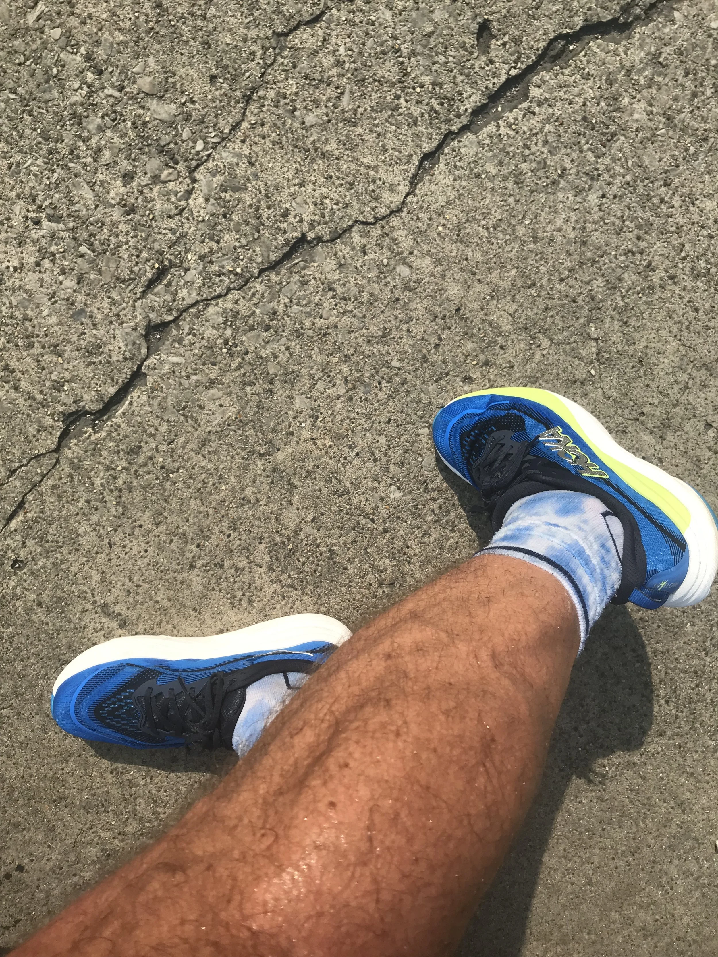 closeup of man wearing HOKA Skyflow