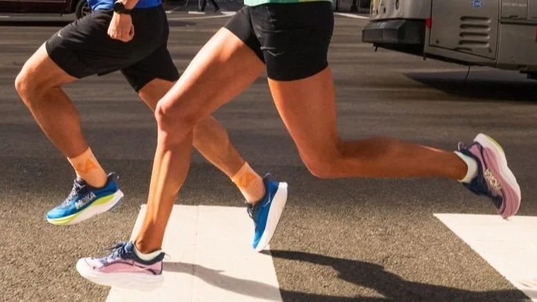 Closeup of runners in HOKA Skyflow