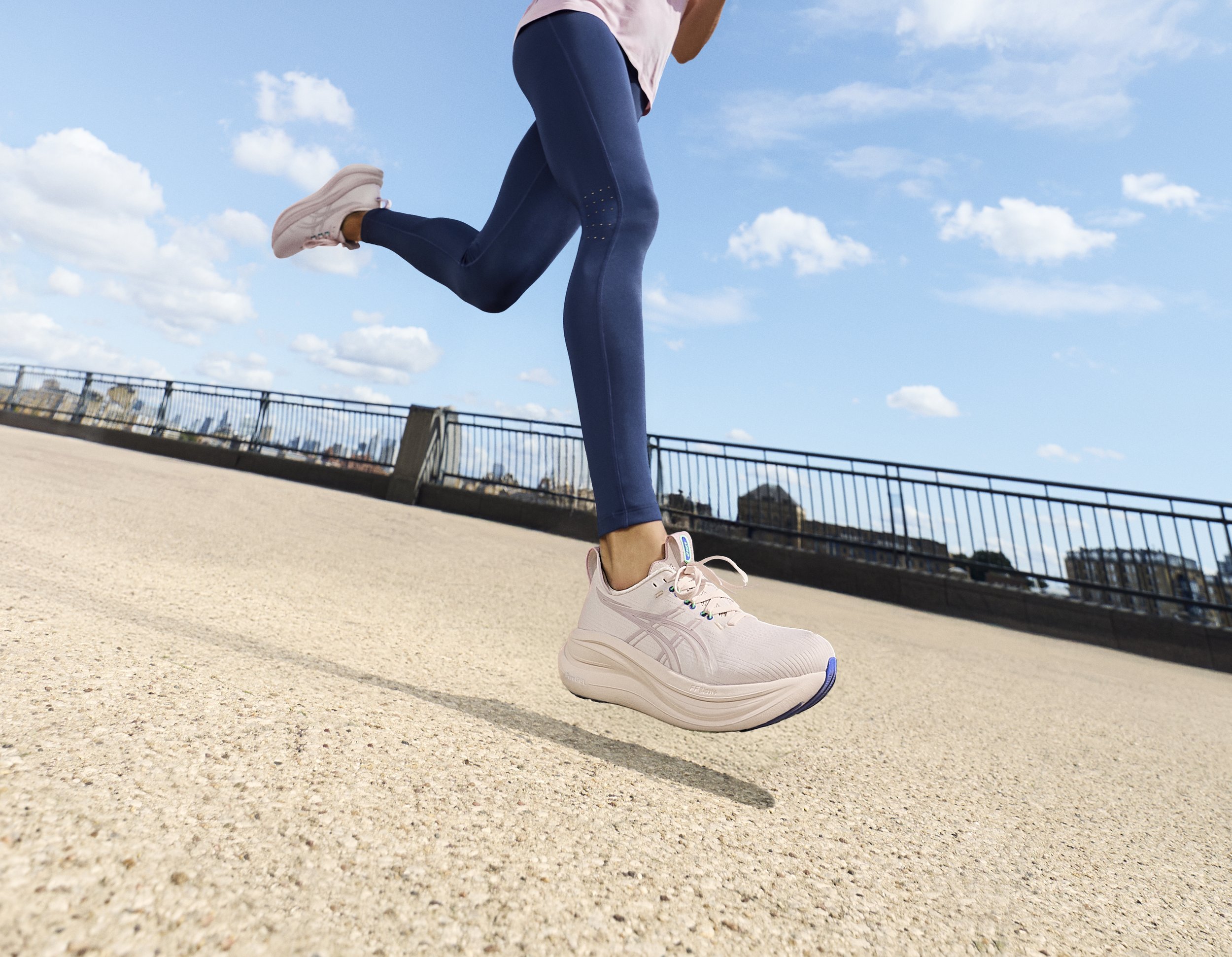 closeup of woman running in ASICS GEL-Nimbus