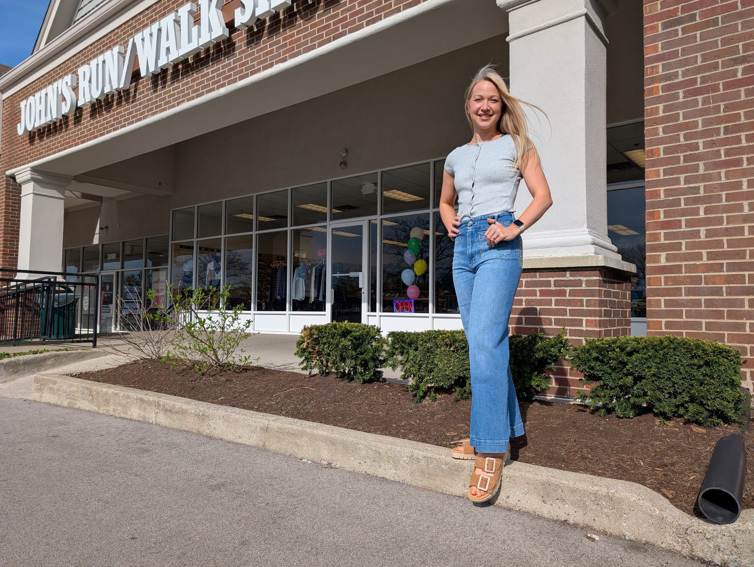 woman standing outside John's Run/Walk Shop in Lexington, Ky