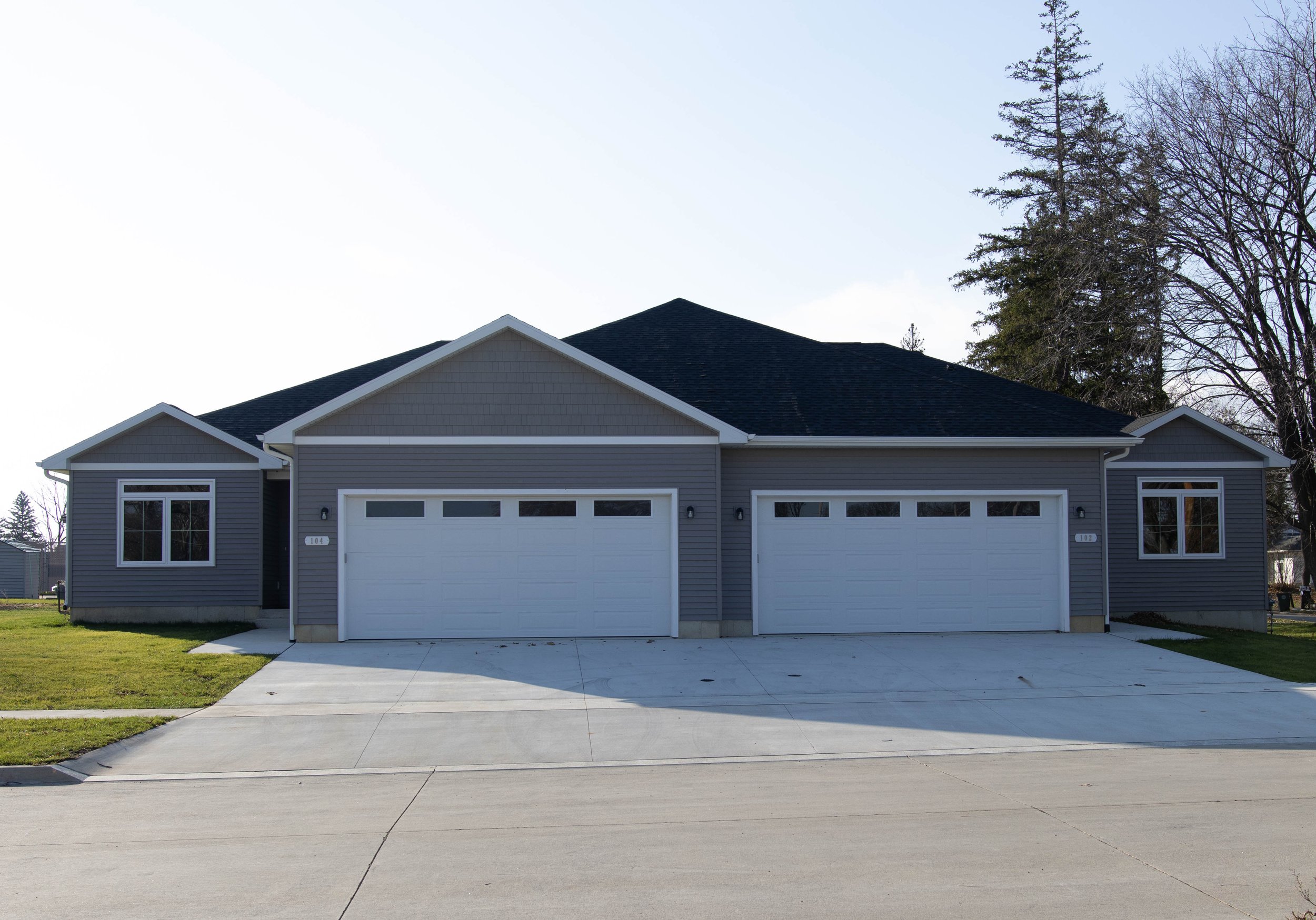 Duplex house with two garage doors. 102 and 104 Bergen Dr., Waterloo are for sale.