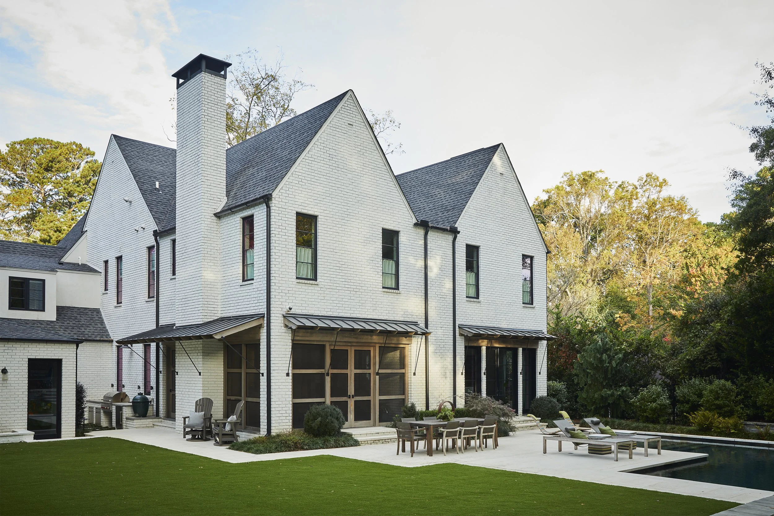 Backside of the home with patio and pool.