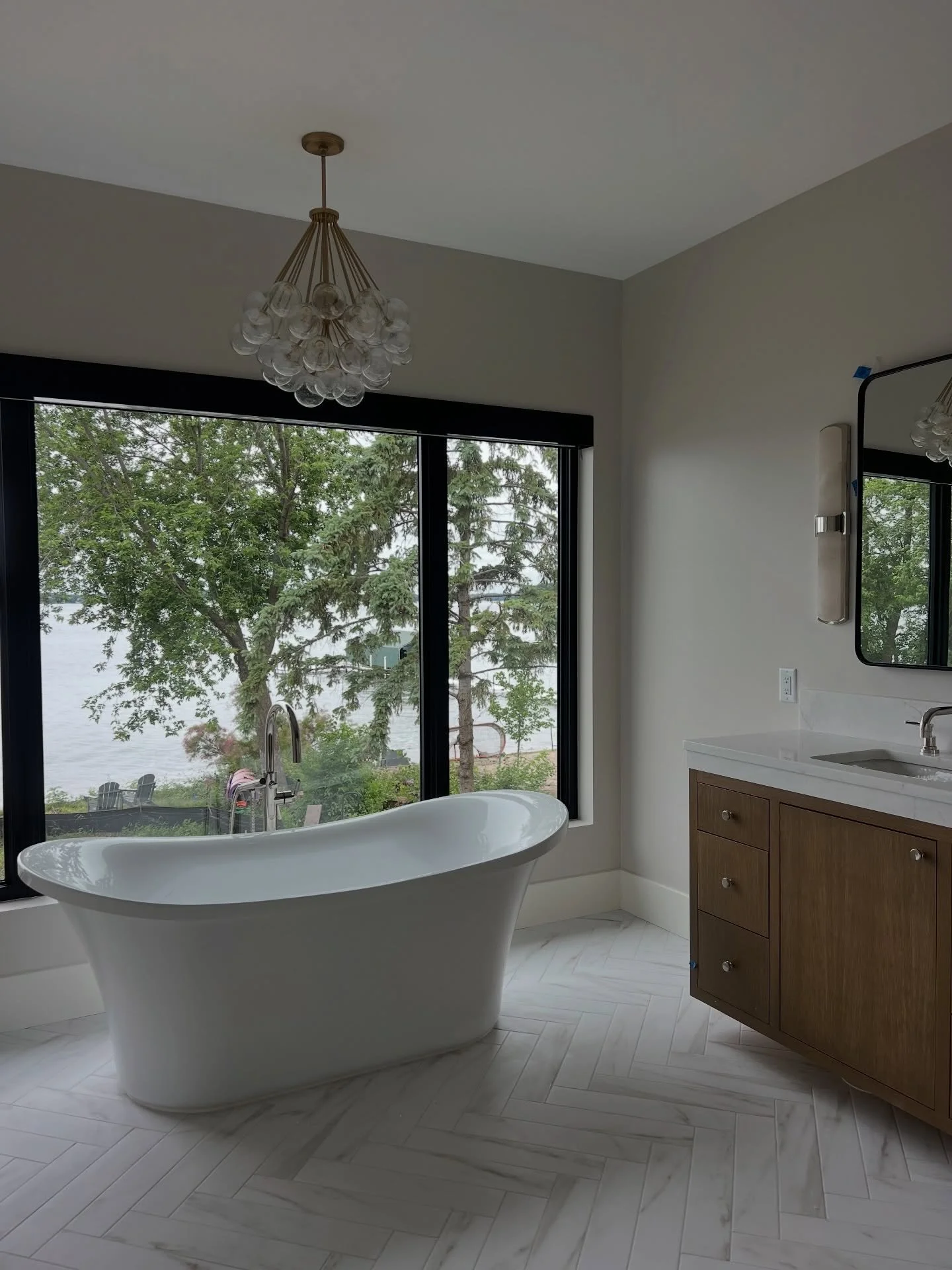 When the view becomes part of the design 😍

The shower tile is a stand out feature for us, what&rsquo;s yours?

#LakeHomeLiving #MinnesotaBuilder #CustomHomeDesign #BuiltWithPurpose [lake home builder minnesota, custom home design minnesota, luxury 