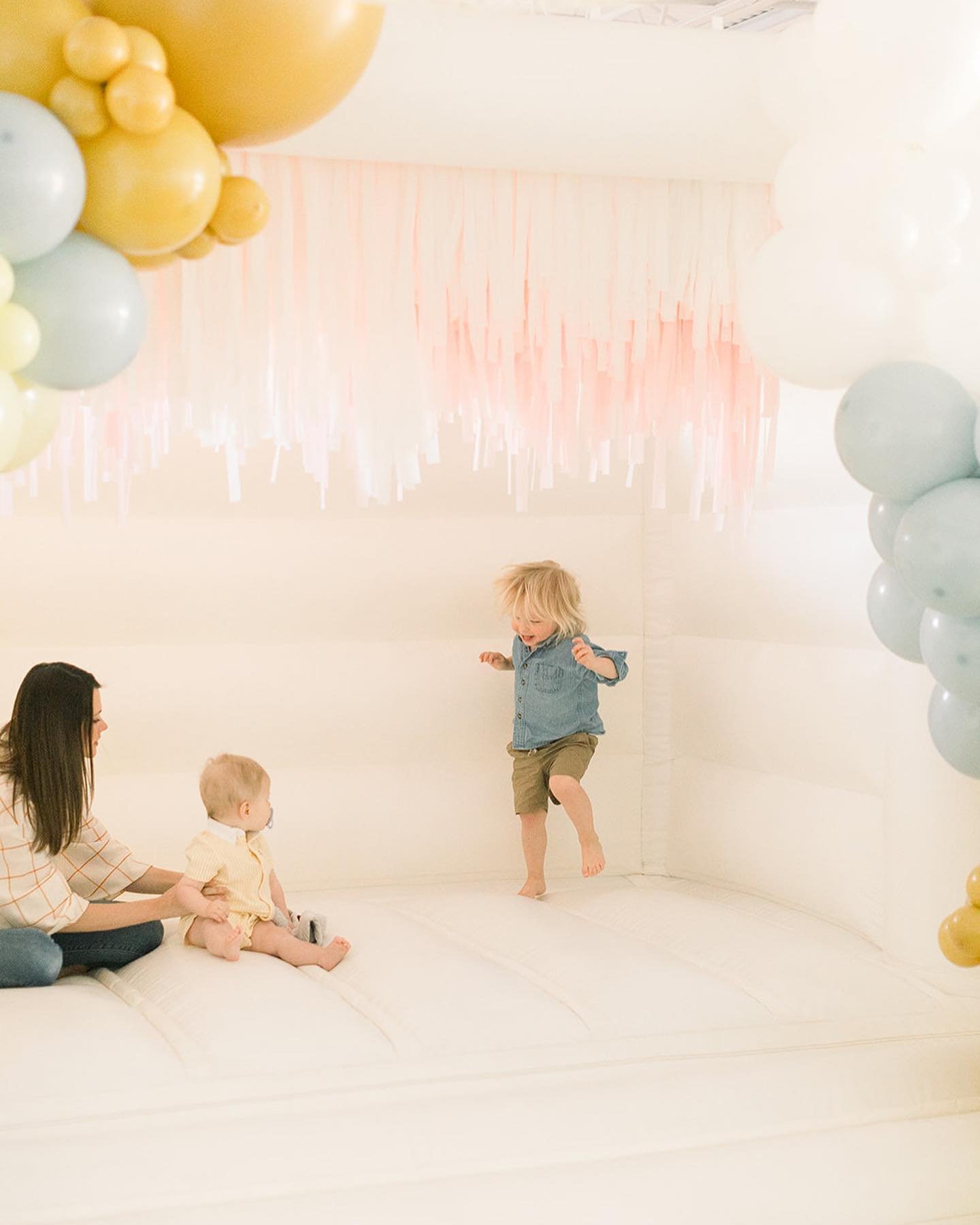 Adding a little sunshine to your feed on this gloomy day ☀️

How sweet is this little party!?

You can recreate this look with our &ldquo;So Classic&rdquo; bounce house, fringe add on, and our balloon services! 

Vendor list 🤍
Event Planning + Styli