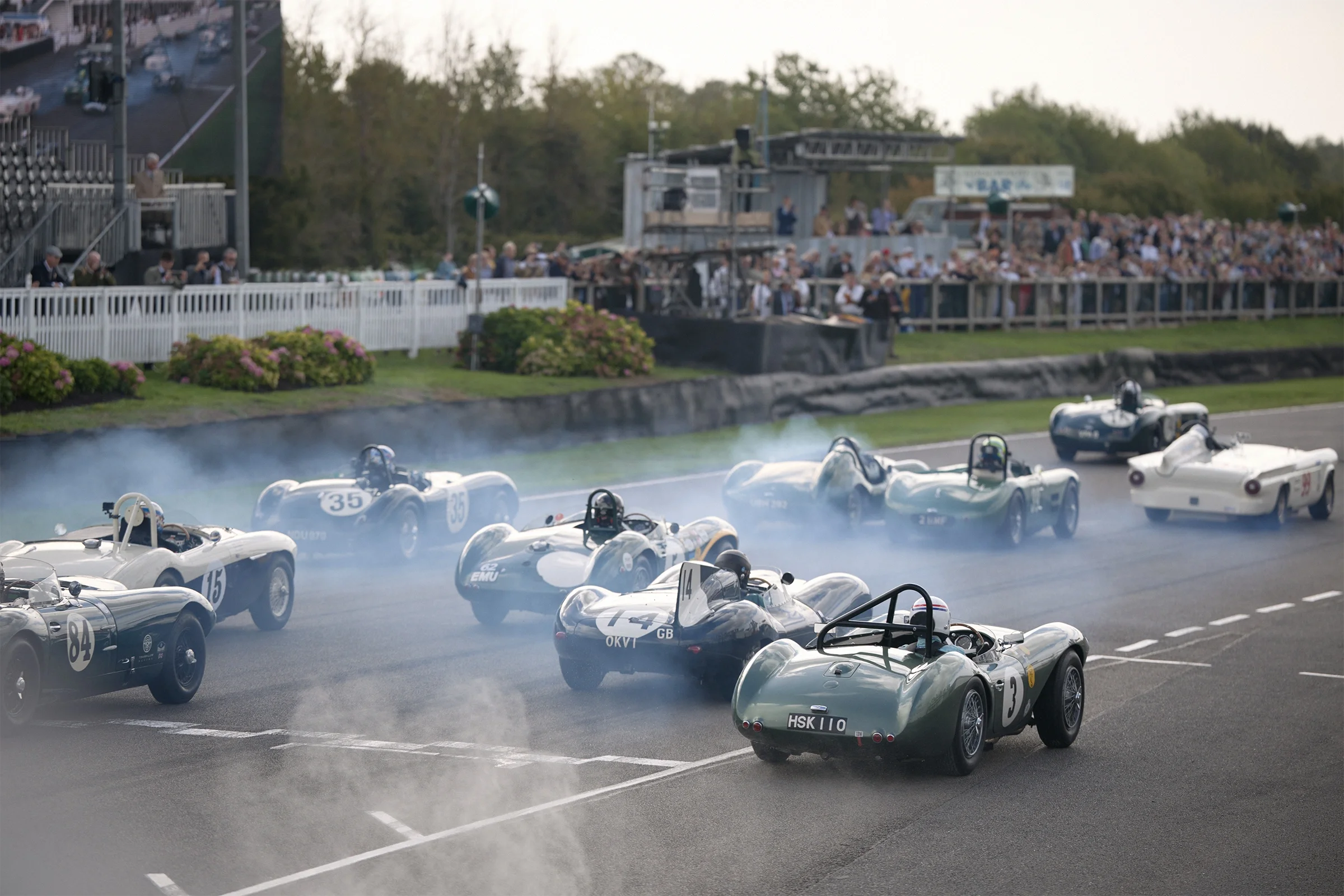 Racing cars lined up at the start of a race at Goodwood Revival 2026