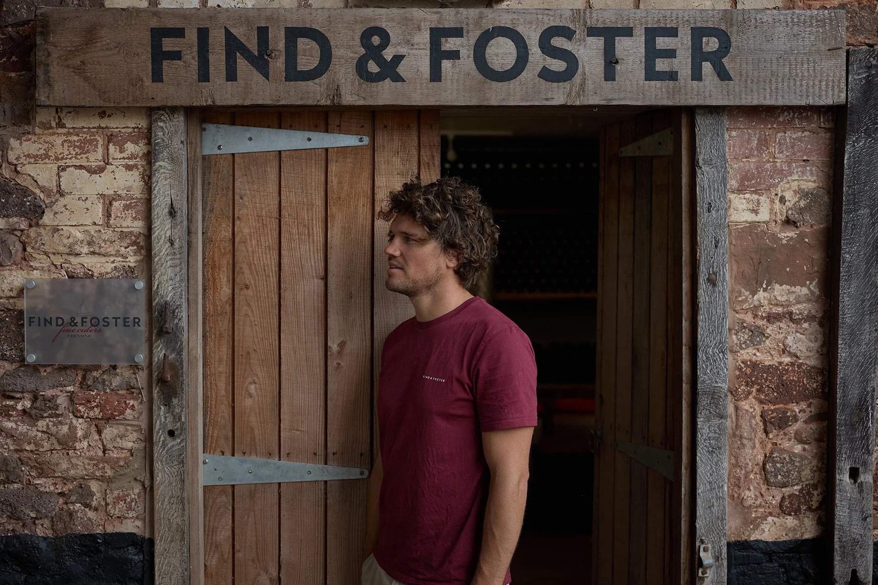 A candid environmental portrait of Mat outside the Find & Foster cidery in Huxham, Devon.