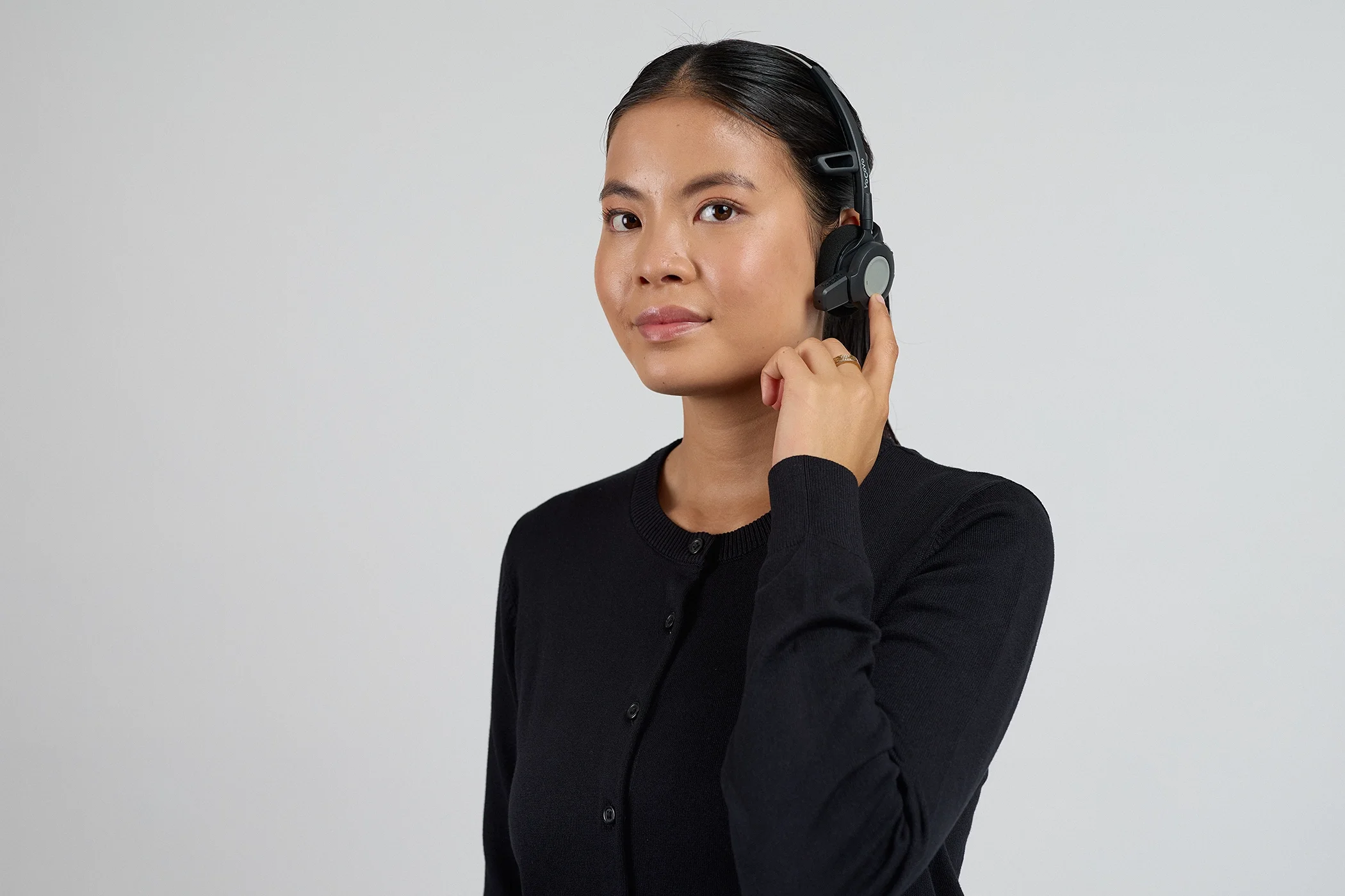 Professional product photography of a model wearing a VoCoVo communication headset.