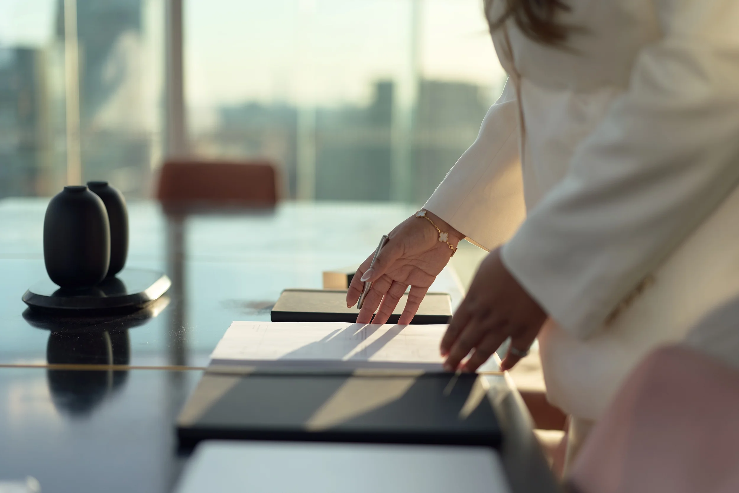 Close-up of a business owner signing a contract with a pen