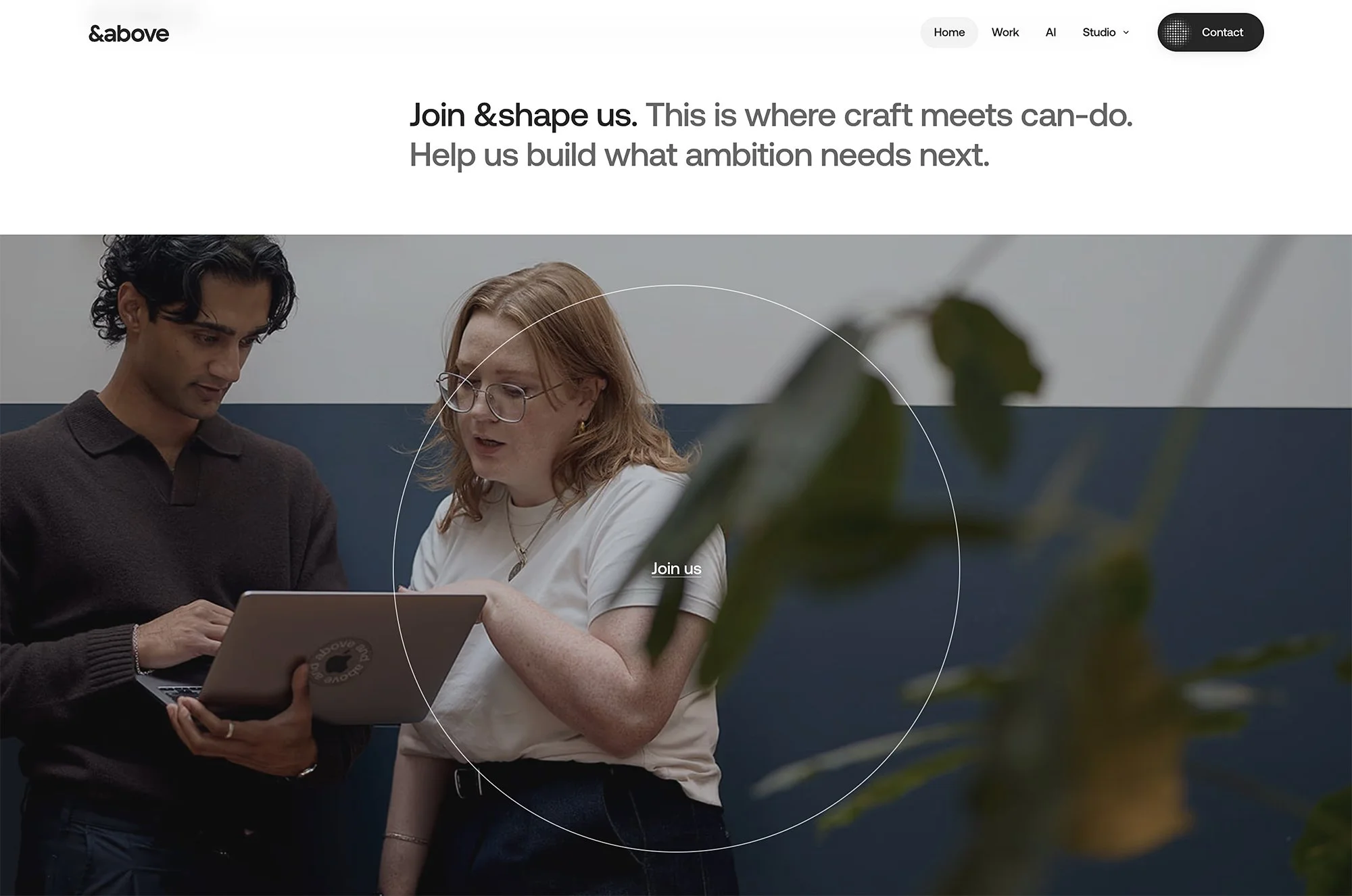 A wide banner showing the &above team collaborating in their modern, open-plan London studio.
