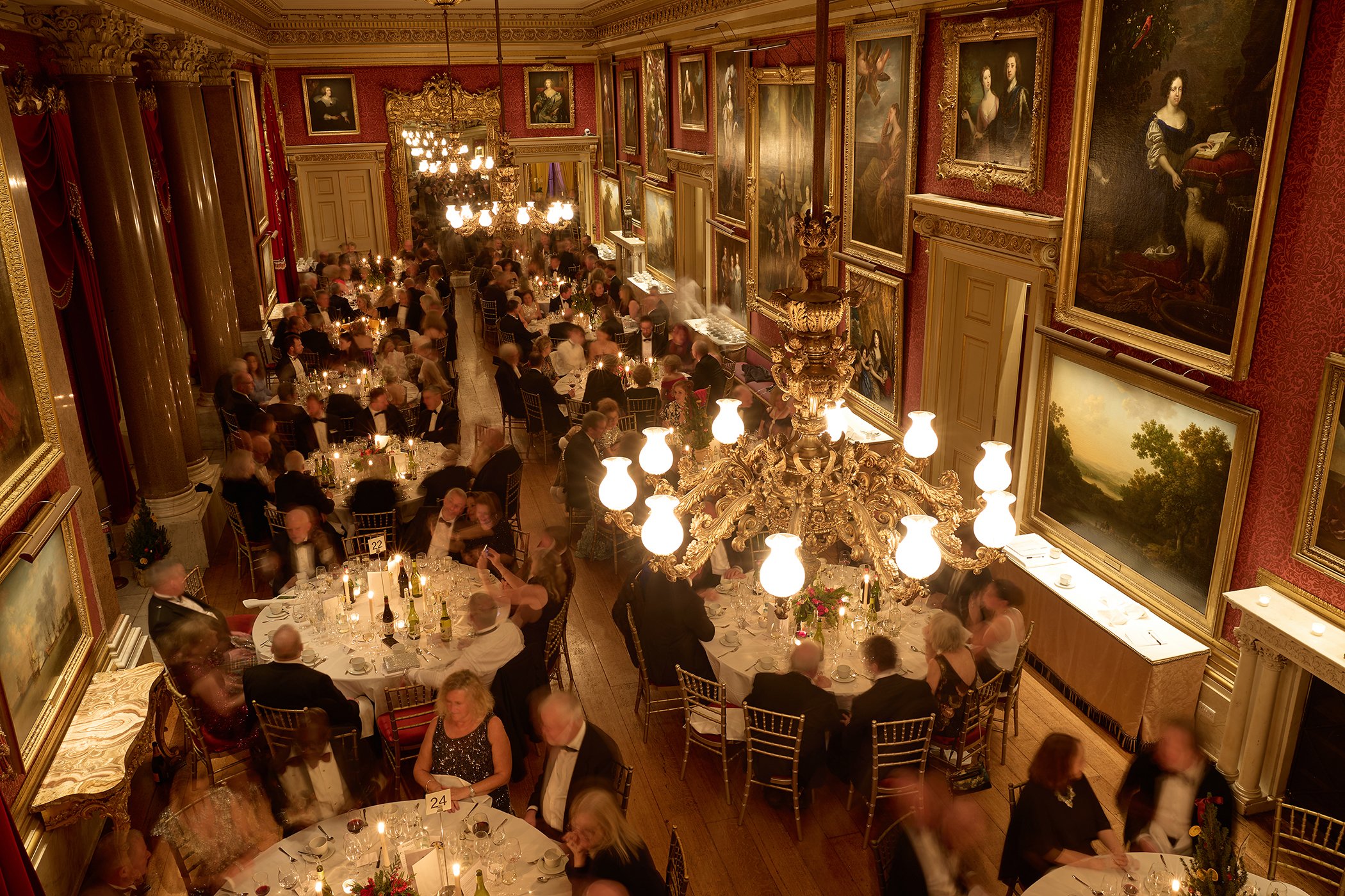 Wide shot of guests attending the Goodwood GRRC Ball in an elegant ballroom