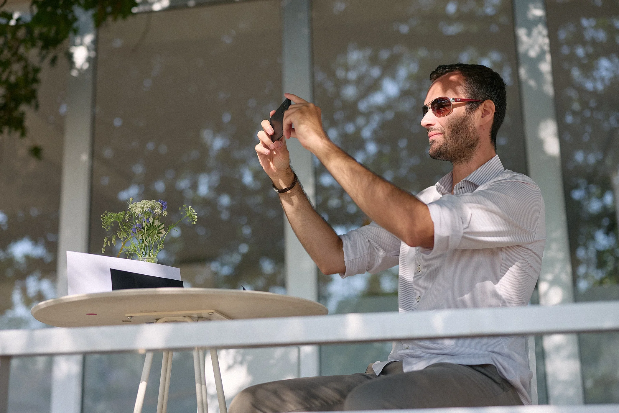 Spectator taking photographs of cars on track during the 2026 Goodwood Festival of Speed.