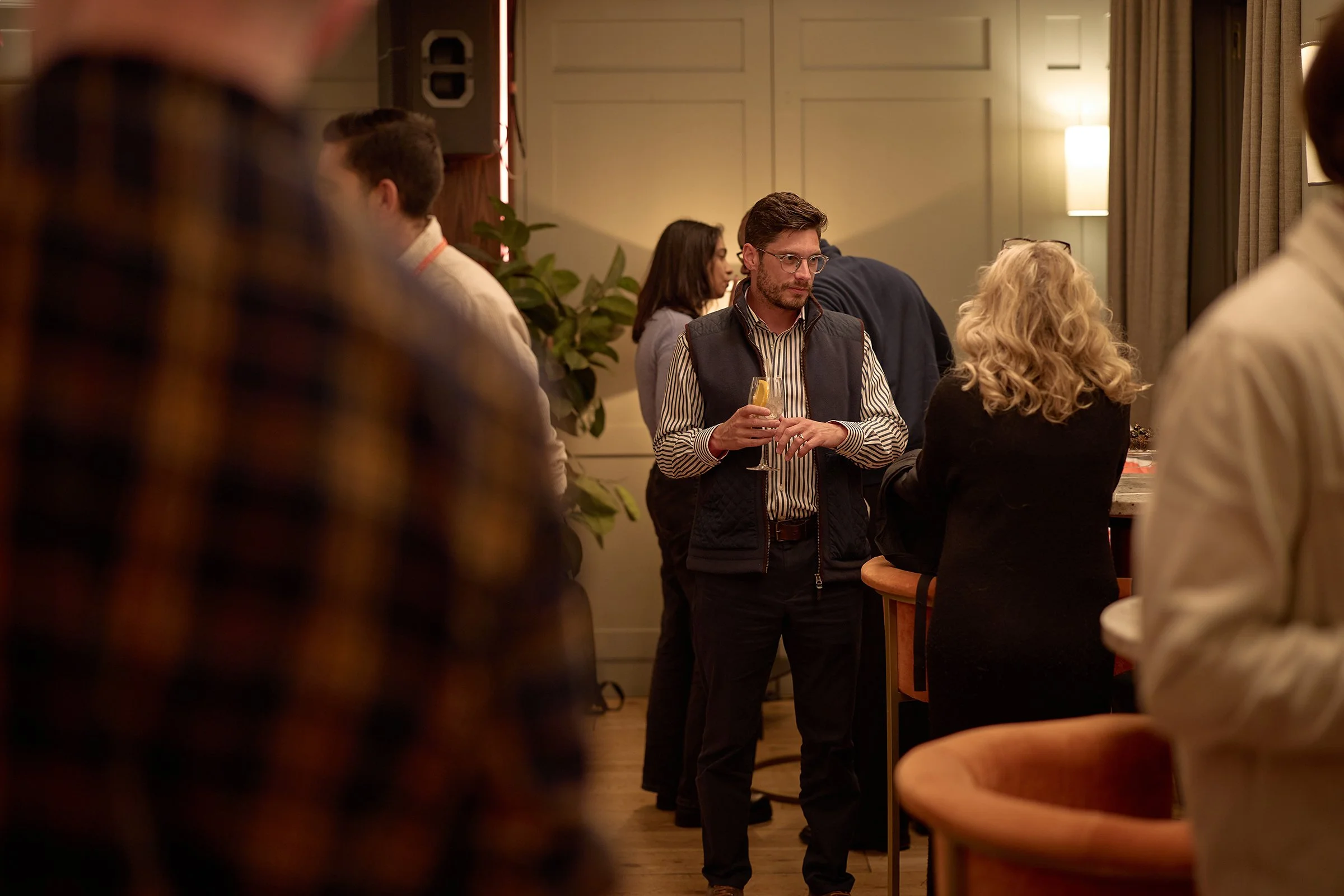 Business partners and team members networking at the GetYourGuide Soho event, documenting authentic human connection and event atmosphere for commercial PR use.