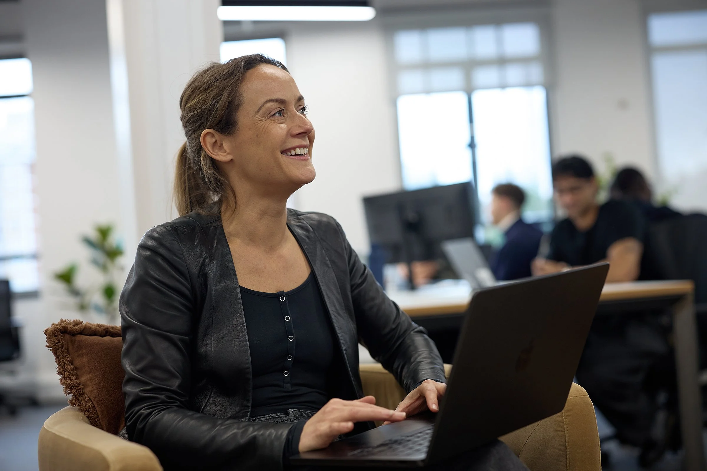 Authentic lifestyle team photography of the &above design and AI agency at their London studio, capturing technology, collaboration, and working culture.