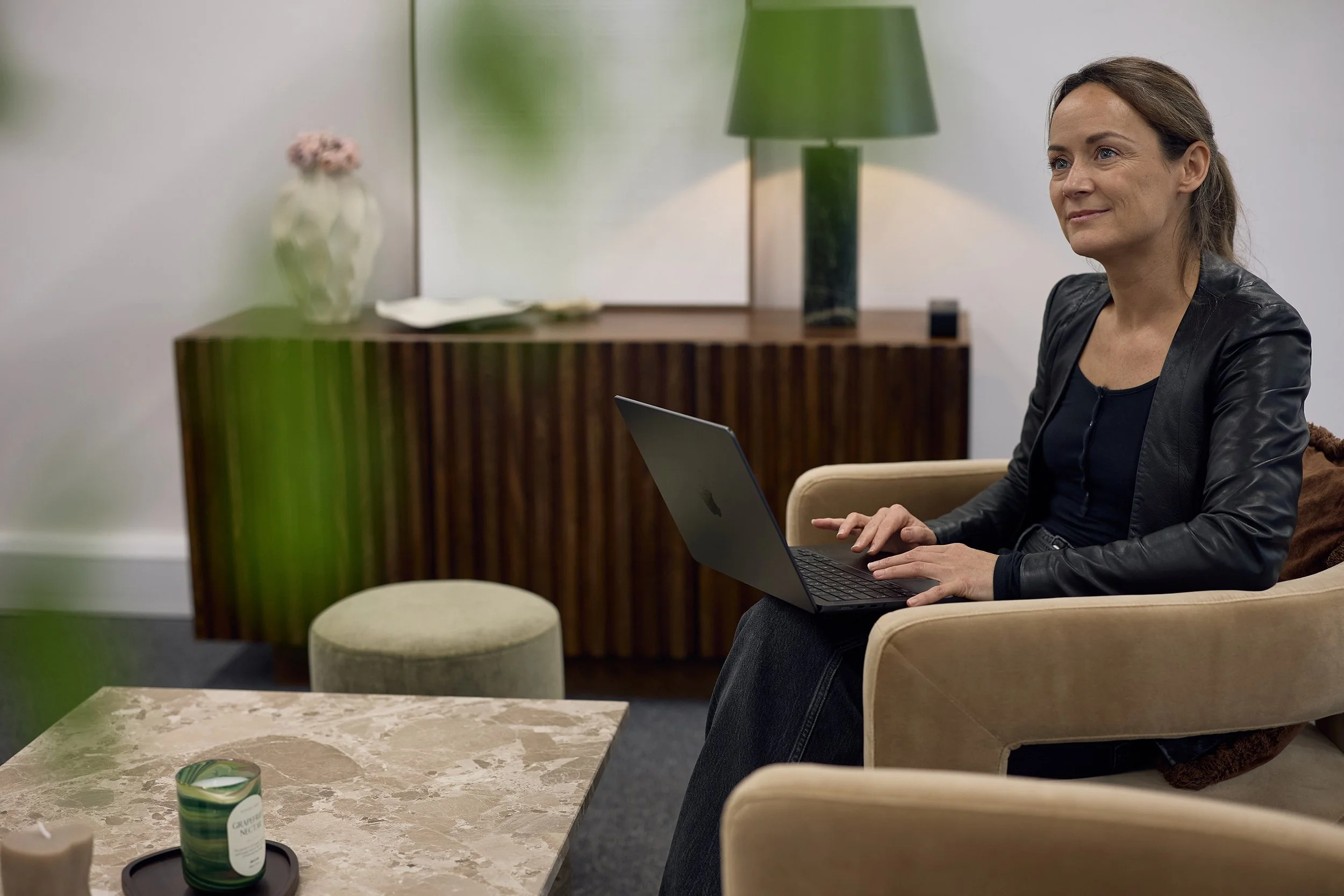 Lifestyle business photography of the design lead at &above working in their London office environment.