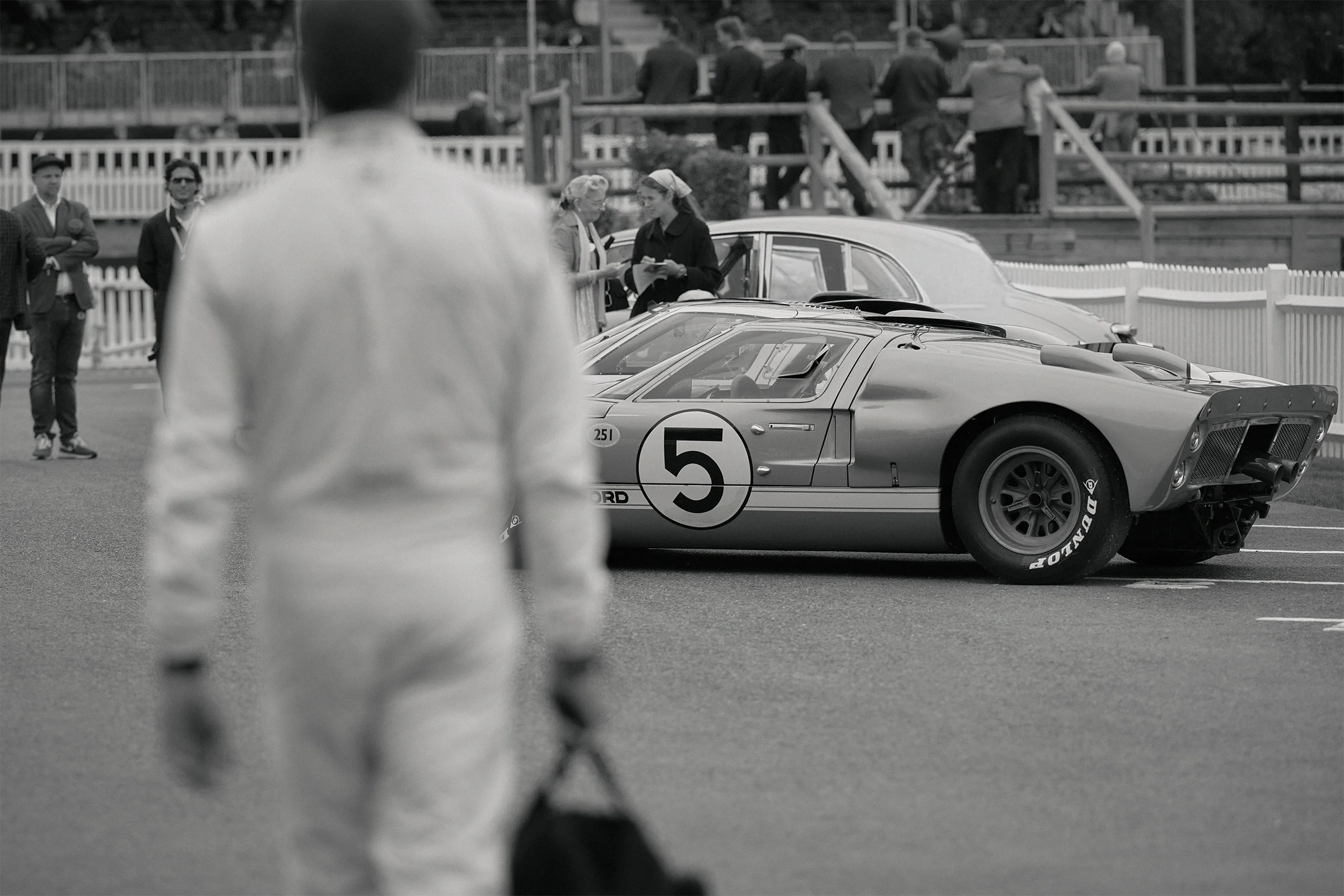 Scott Dixon walking towards the Ford GT40s for a track moment at Goodwood Revival 2026