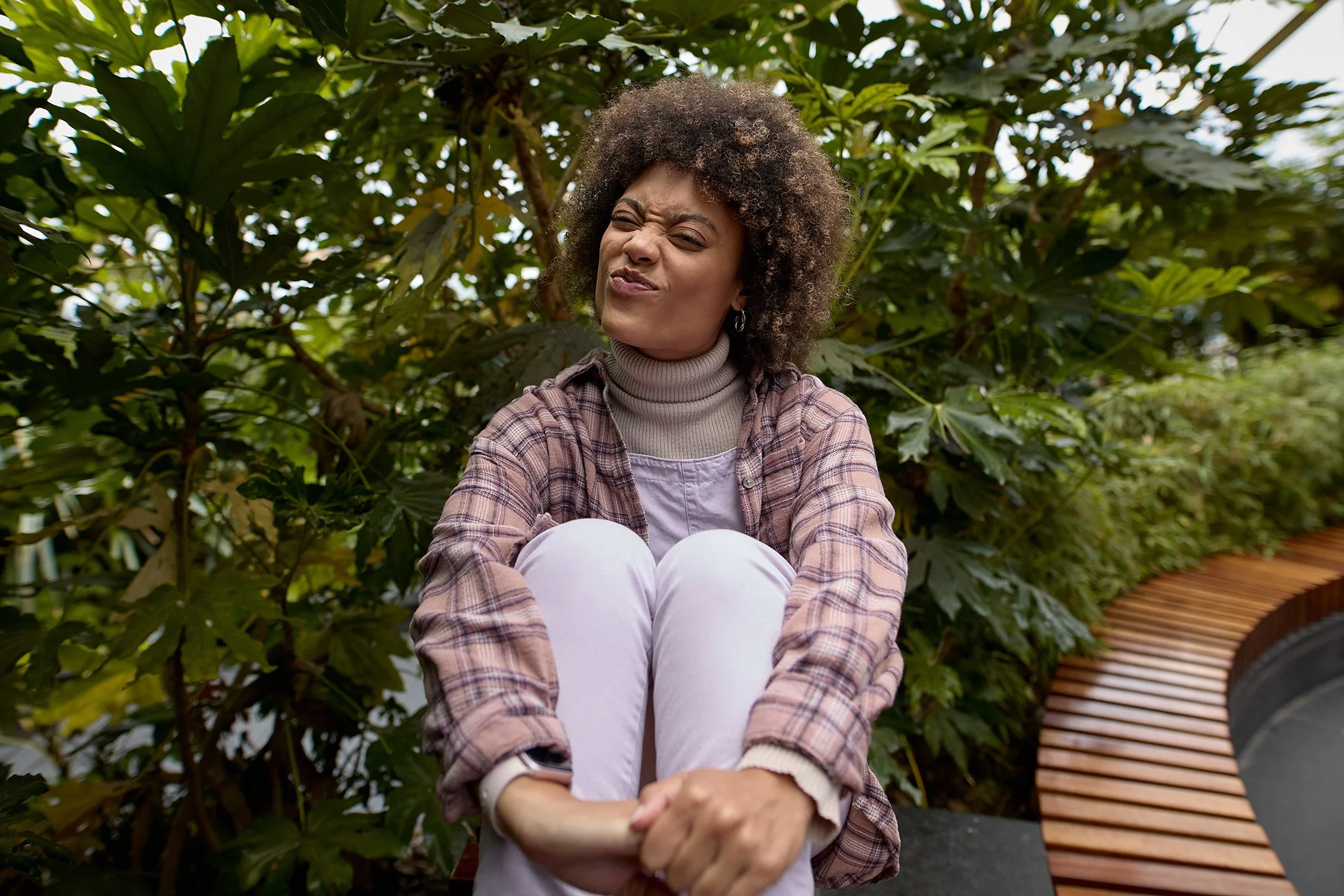 Authentic fashion photography in Canary Wharf, London, featuring a woman modeling for a luxury brand's lookbook within the Pergola location.
