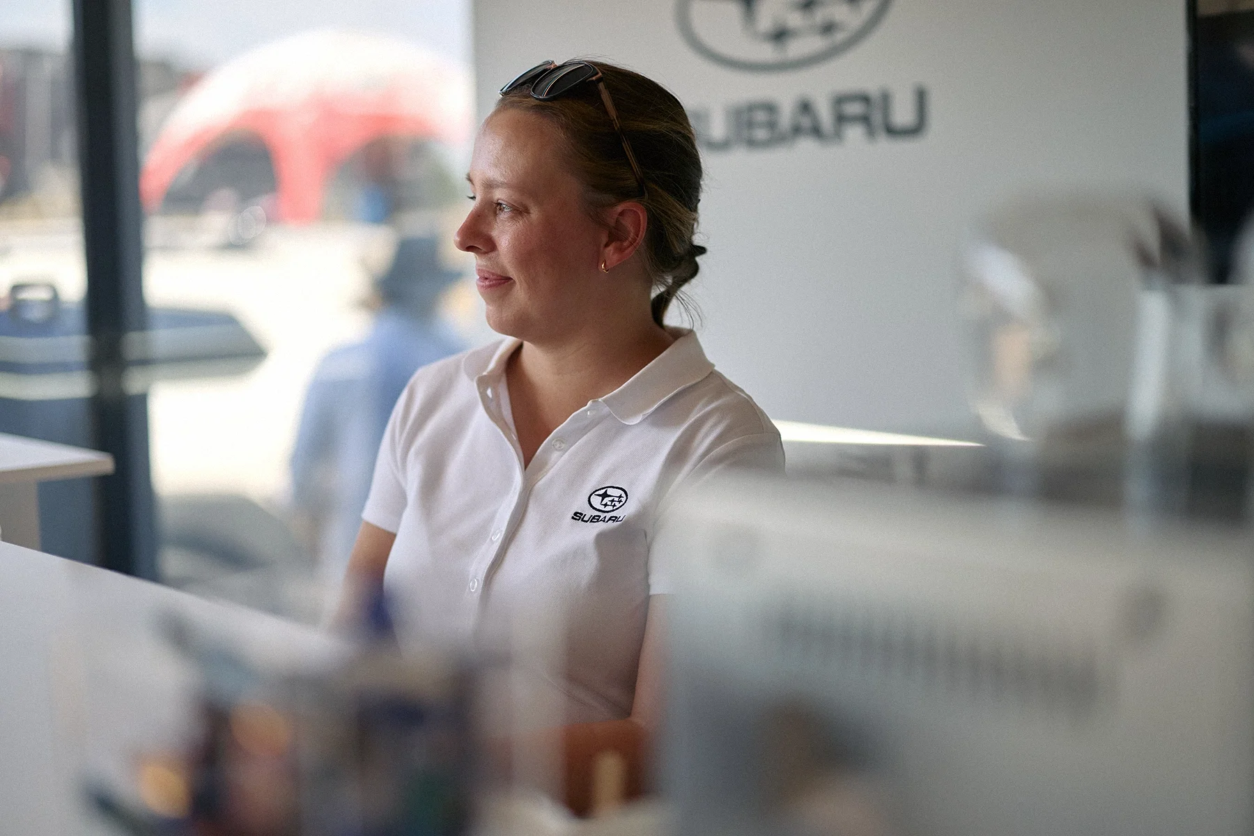 Subaru team member working on the stand at the rally stage during the 2026 Goodwood Festival of Speed.