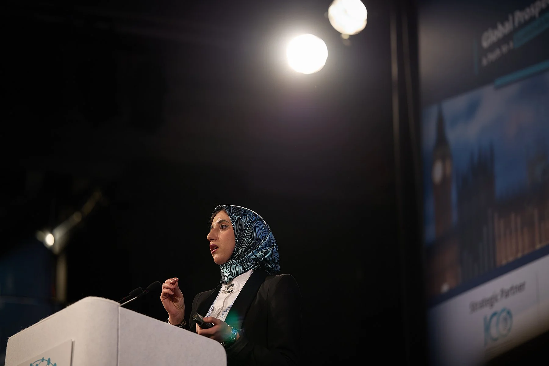 Dr. Widad Metadjer, Lecturer in Islamic Finance at Al-Maktoum College, presenting on ethical economic innovation at the 3rd Al Baraka Summit in London, captured by Matt Ankers Studio.