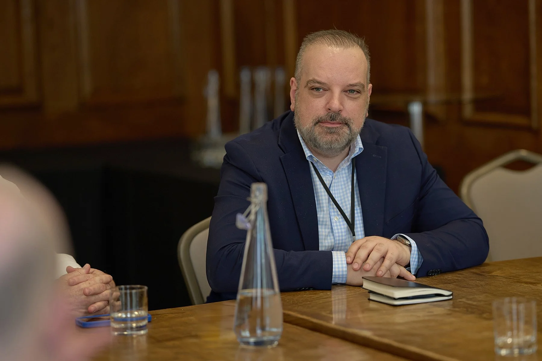 Attendees participating in a sustainable financing workshop during a breakout session at the IHP / PQMD Global Health Summit in London, captured at Goodenough College as part of event photography documenting the conference.