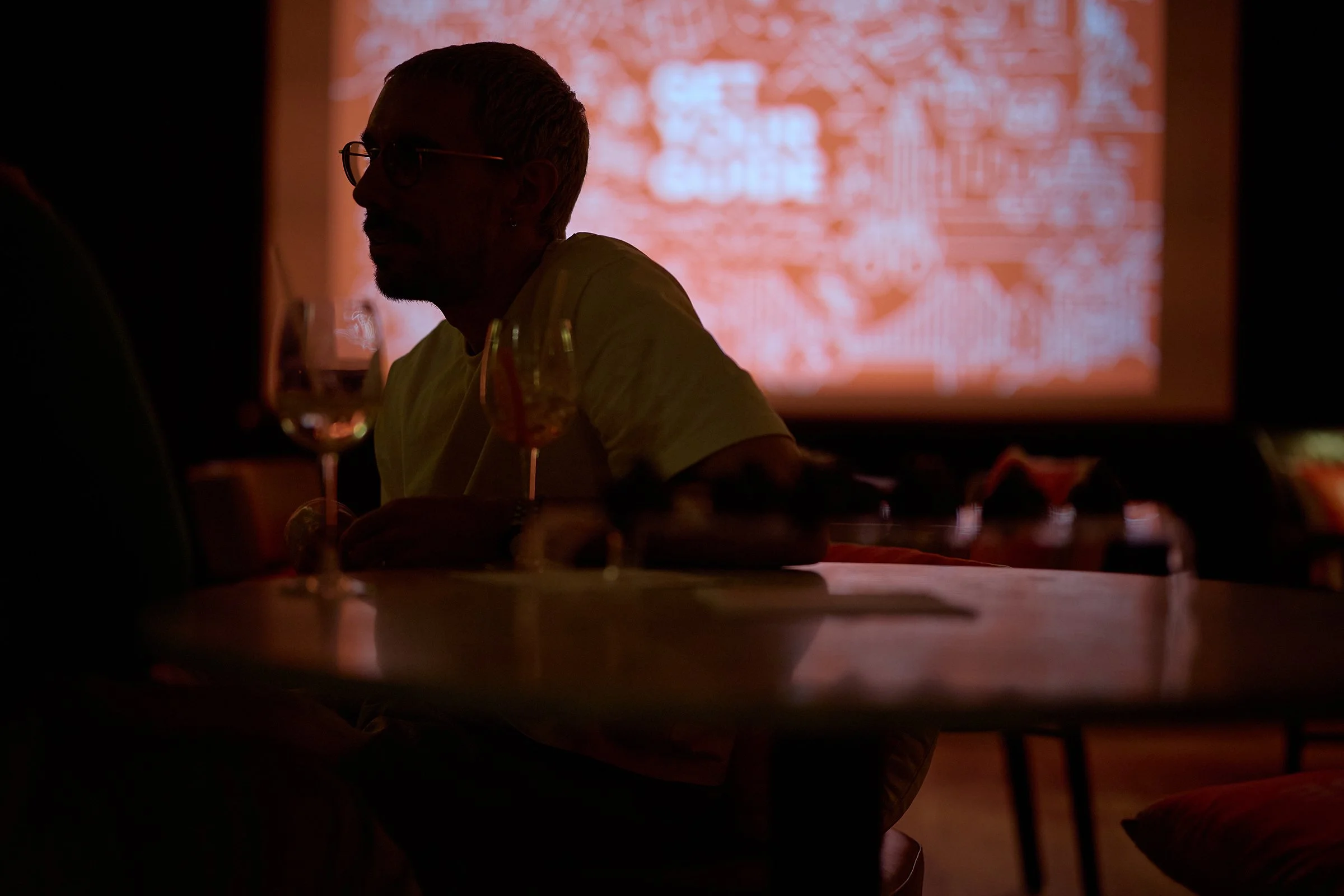 Candid networking photography with drinks at the GetYourGuide London event, documenting professional social interaction for corporate culture marketing assets.