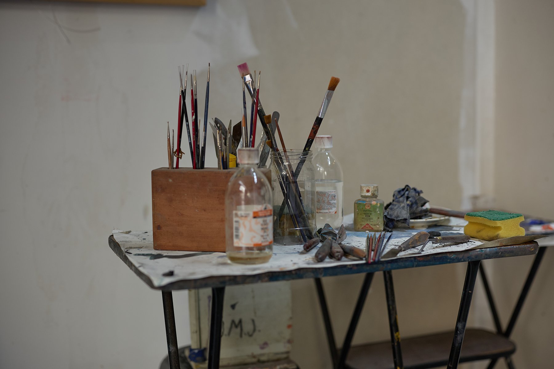 nterior of Porto artist Antonio Bessa’s studio with brushes, paint, and canvases