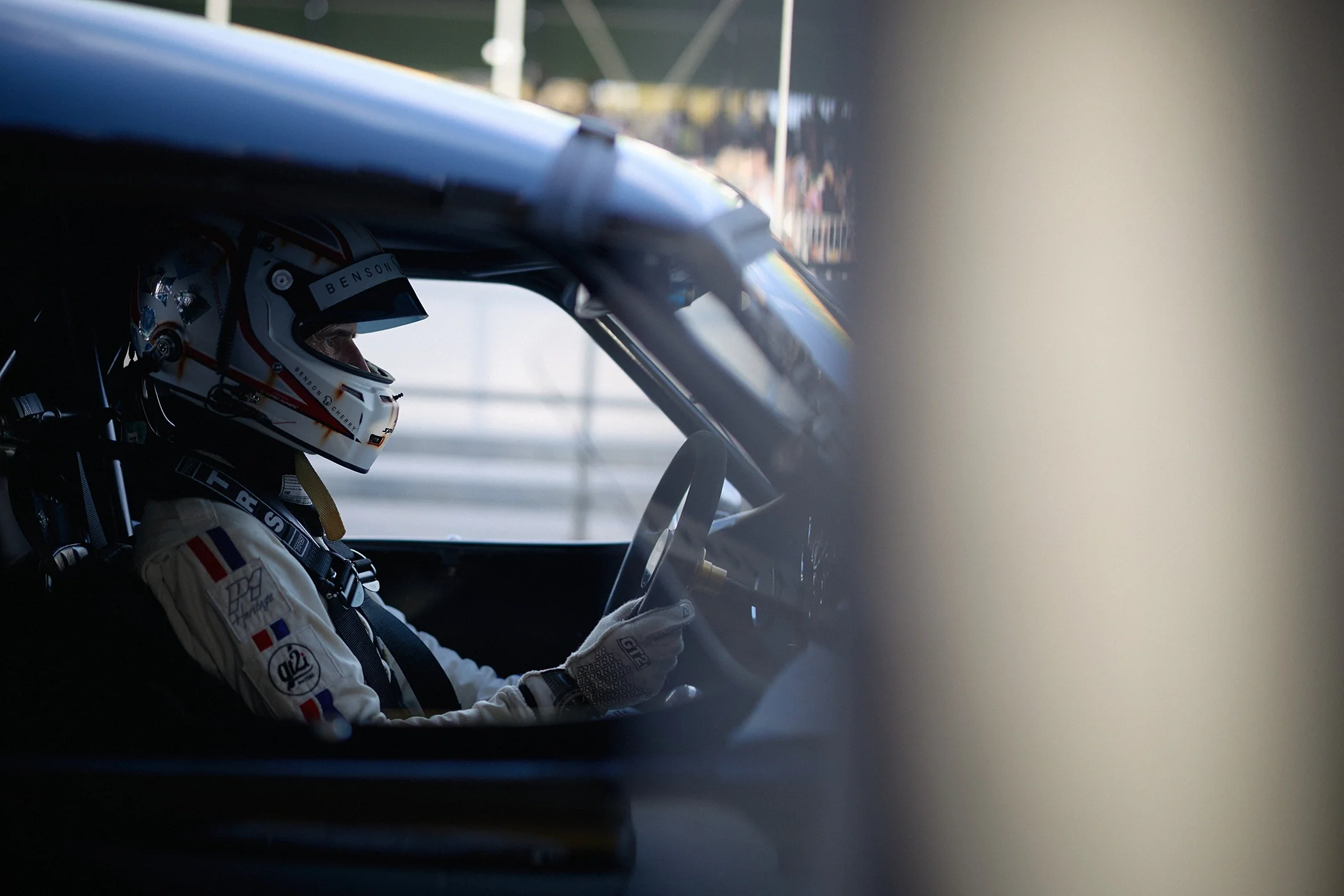 Romain Dumas waiting in his race car in the pit lane before the final race at Goodwood Revival 2026