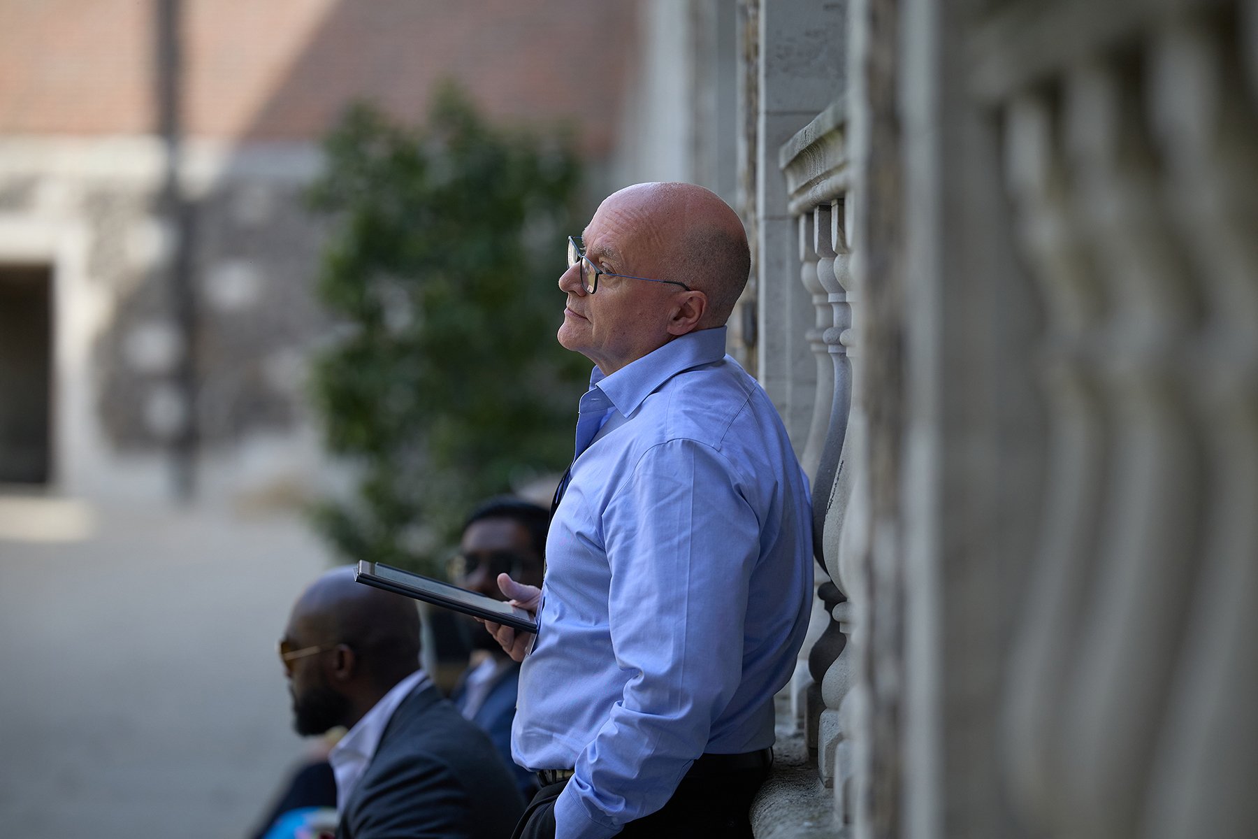 Candid photography of FINN Partners' Mark Chataway engaged in a strategic workshop at Goodenough College for the IHP PQMD Global Health Policy Forum.
