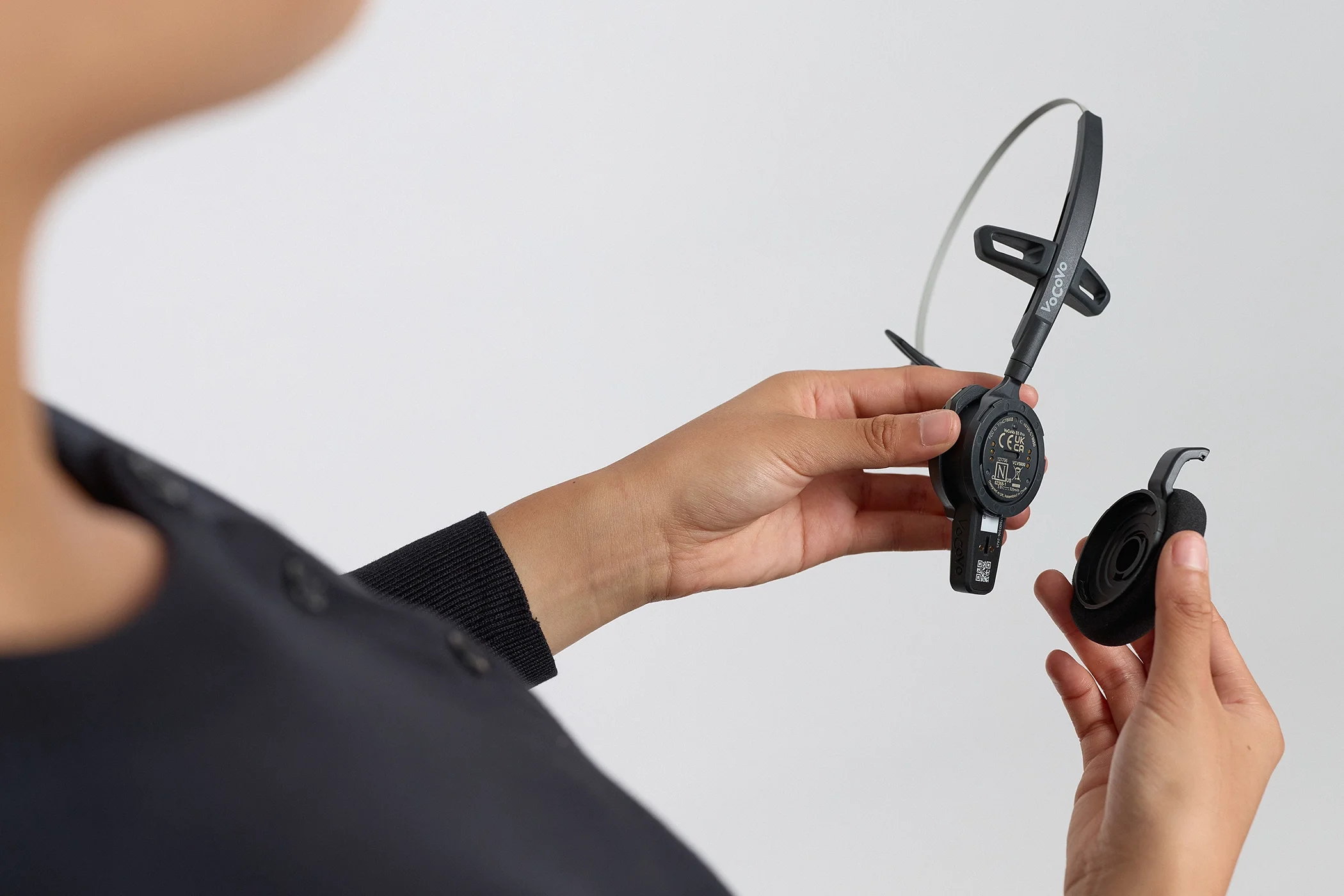 Close-up photograph of a model holding the product to highlight its design, finish and key details.