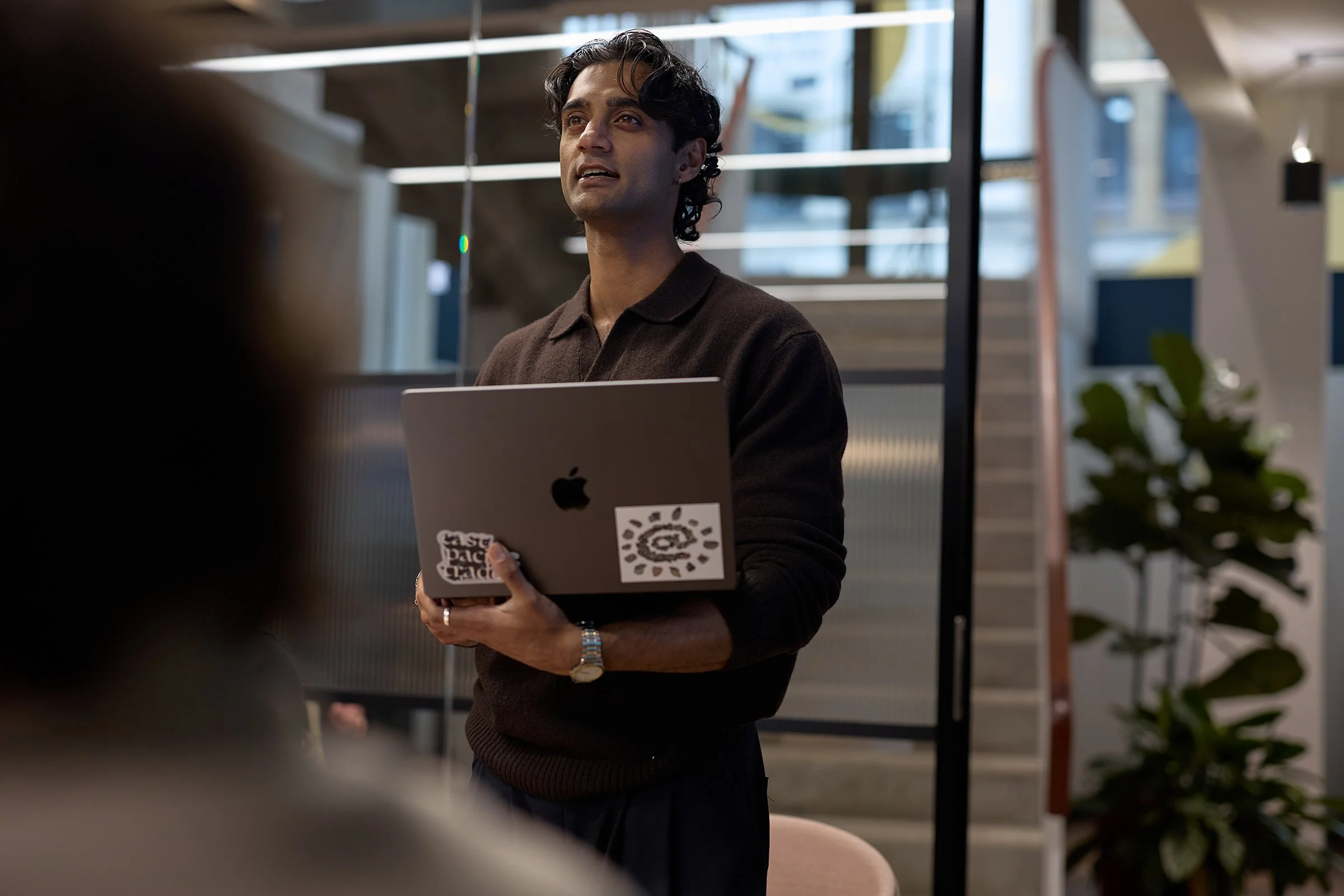 Authentic brand storytelling at the &above London studio, documenting the creative collaboration between designers and AI engineers in a modern workspace.