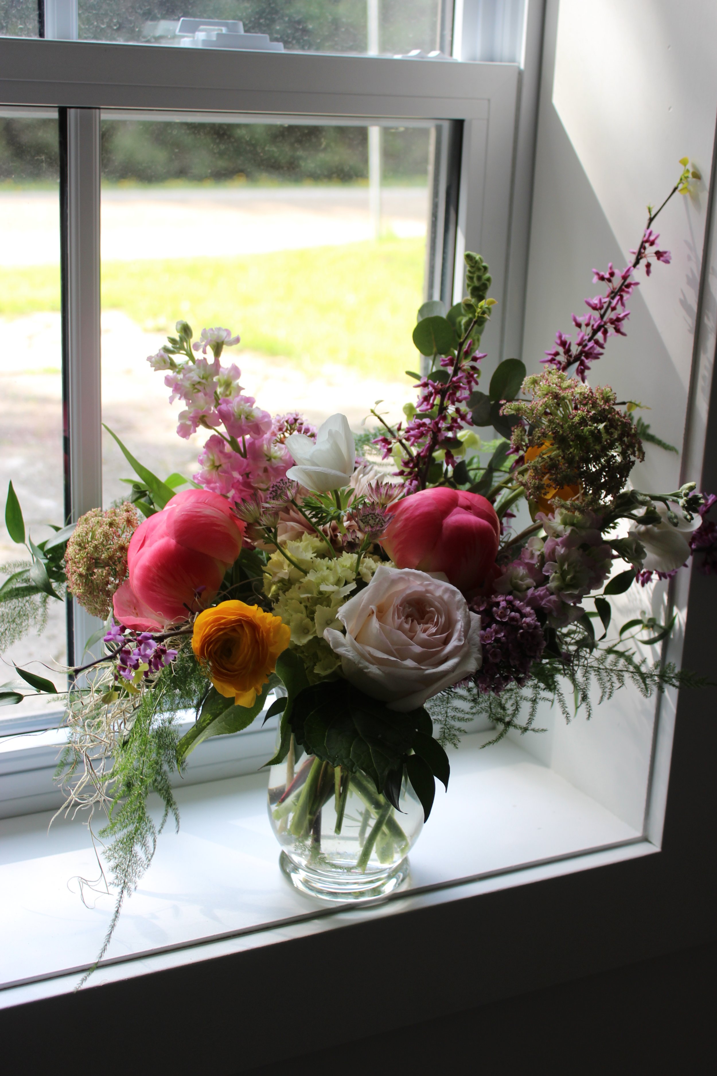 Floral piece by the window