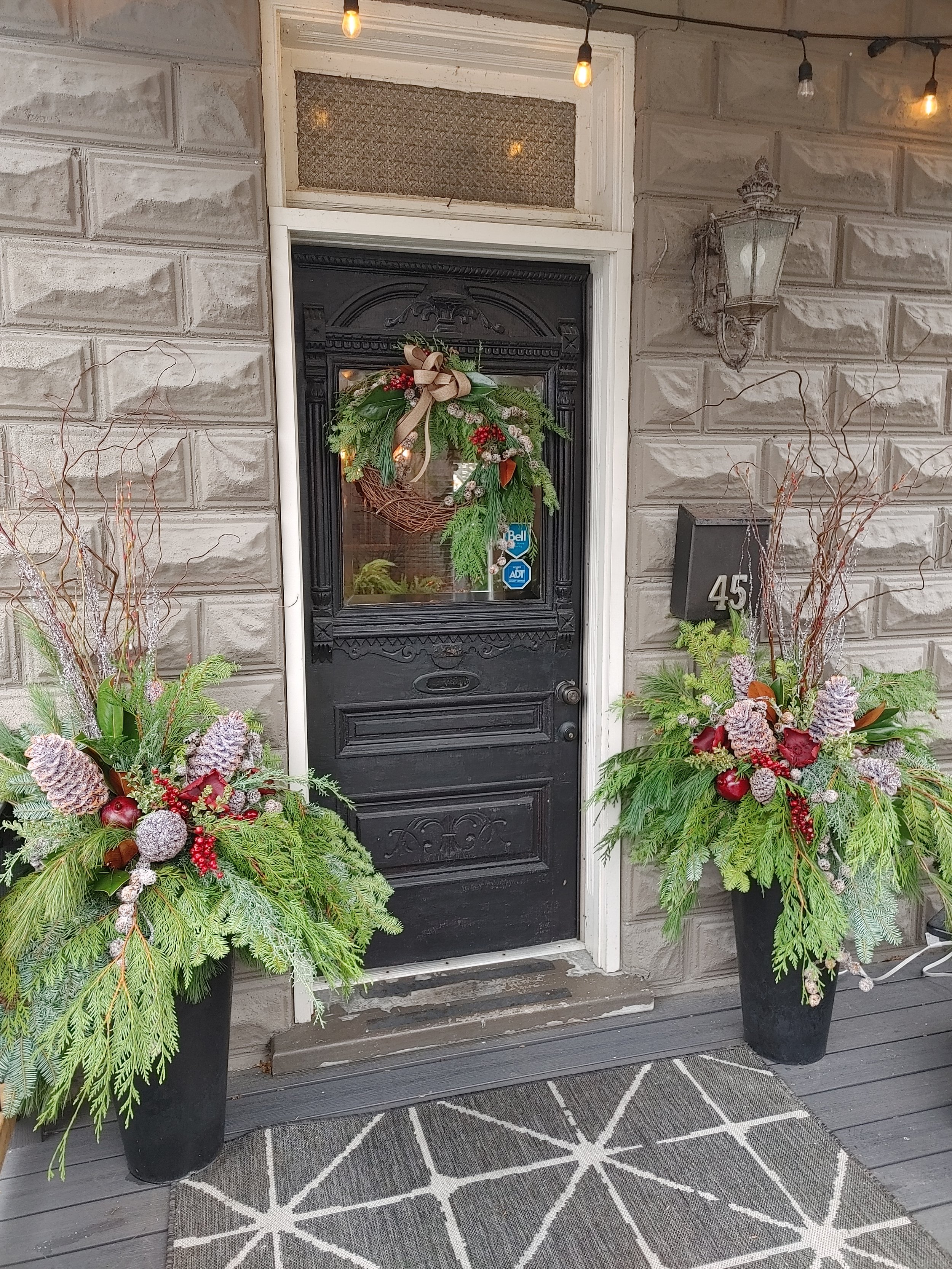 door entrance green and floral decorations