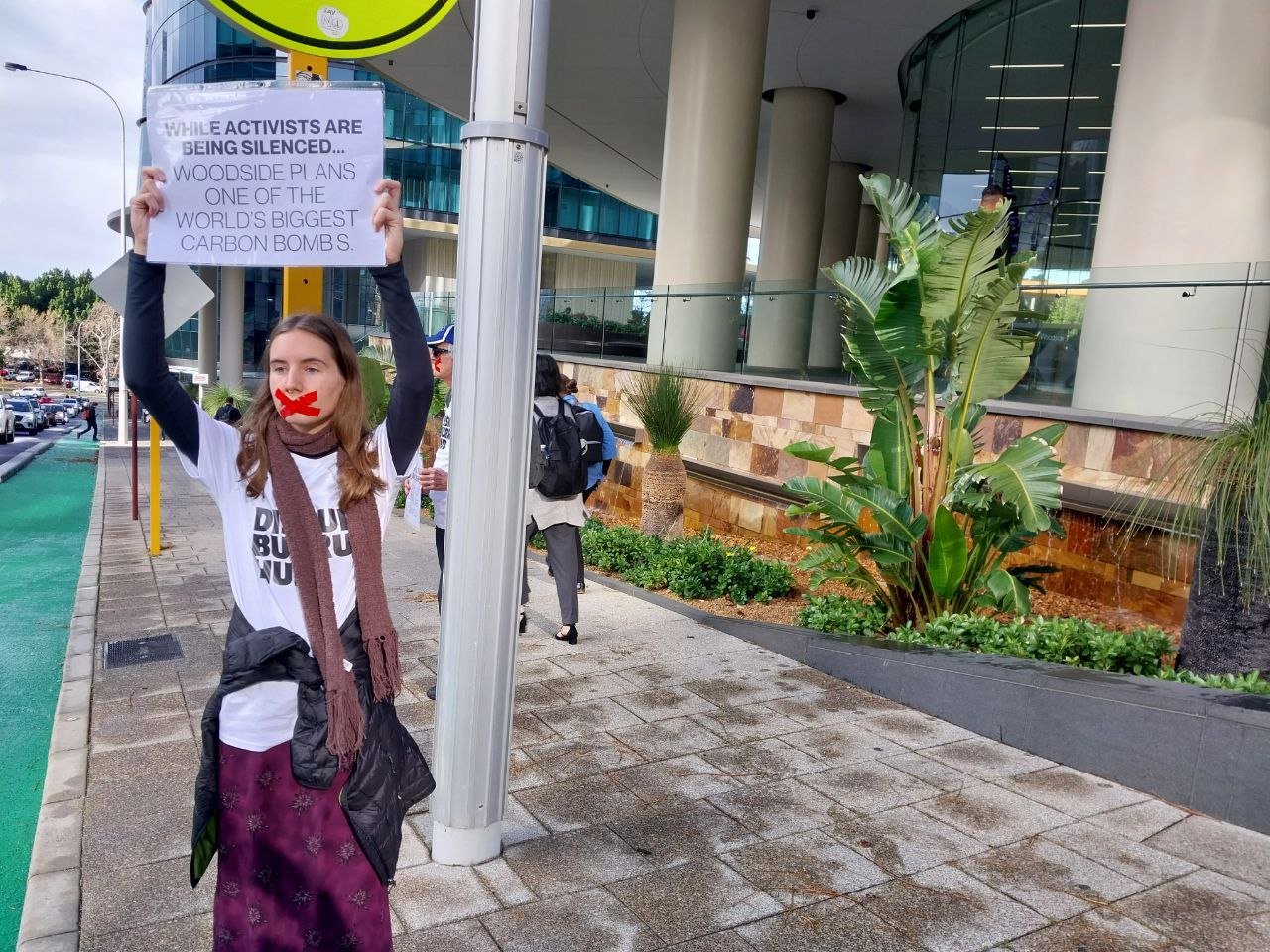 Disrupt Burrup Hub convenes silent protest outside Woodside HQ to call out  VRO's and police repression. — DISRUPT BURRUP HUB