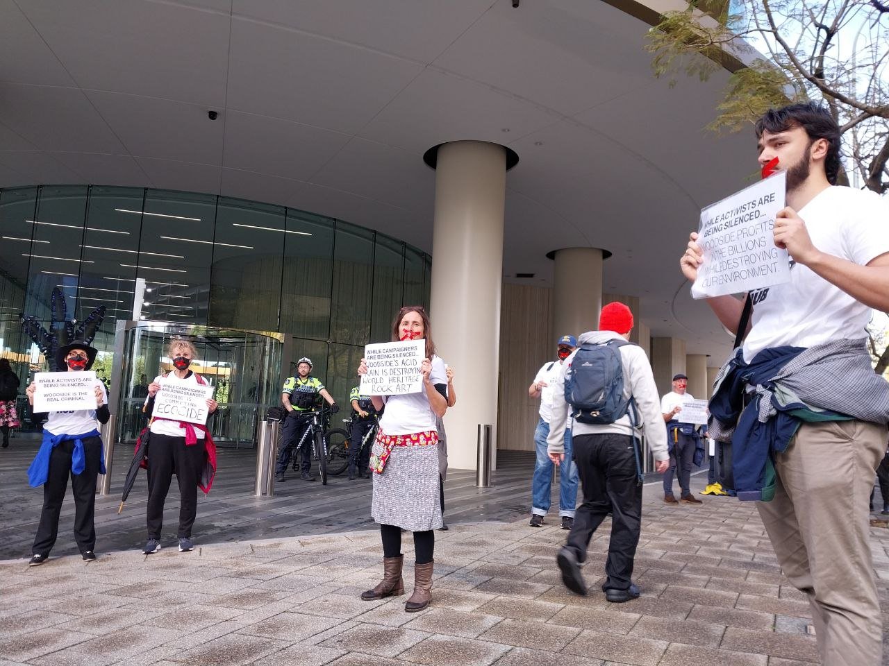 Disrupt Burrup Hub convenes silent protest outside Woodside HQ to call out  VRO's and police repression. — DISRUPT BURRUP HUB