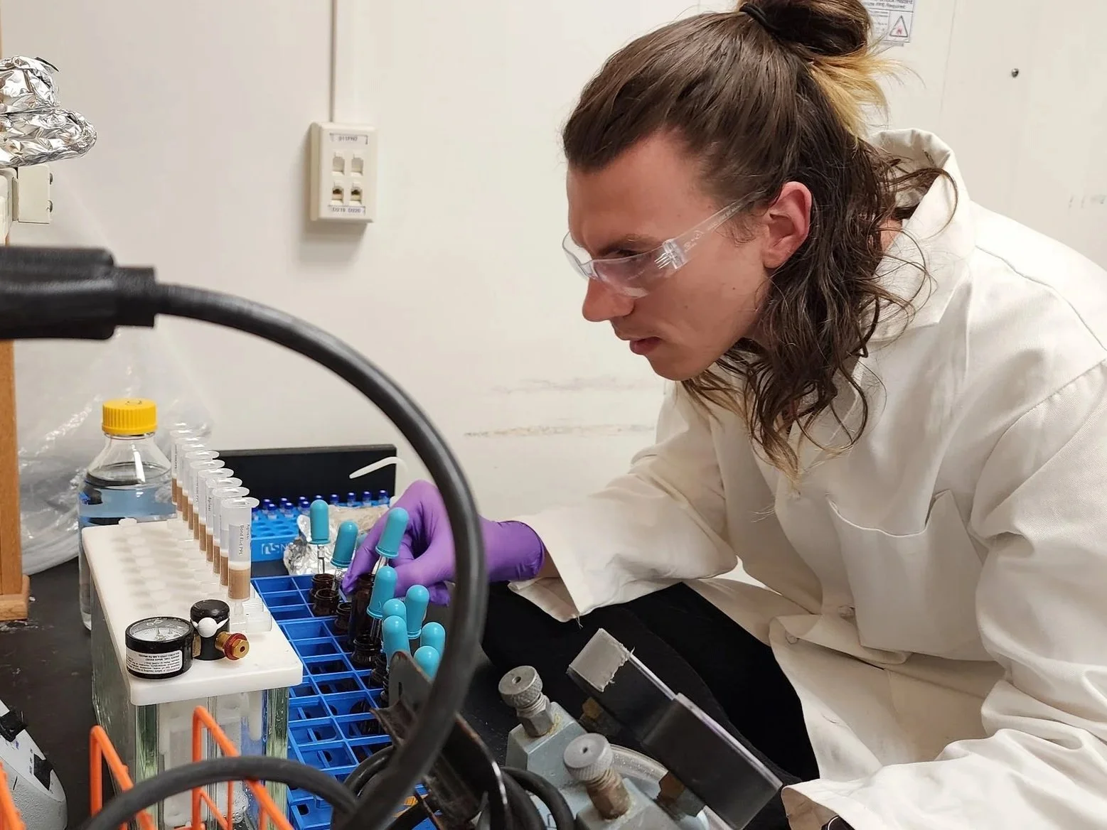 Research scientist Noah Germolus in his laboratory